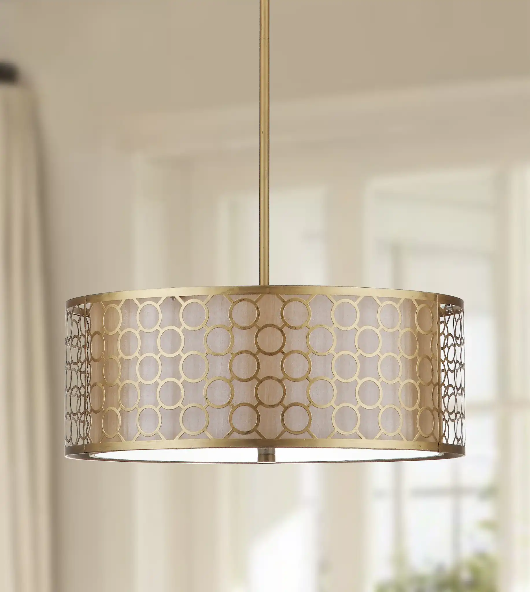 Giotta Drum Pendant Light in Antique Gold in a styled room
