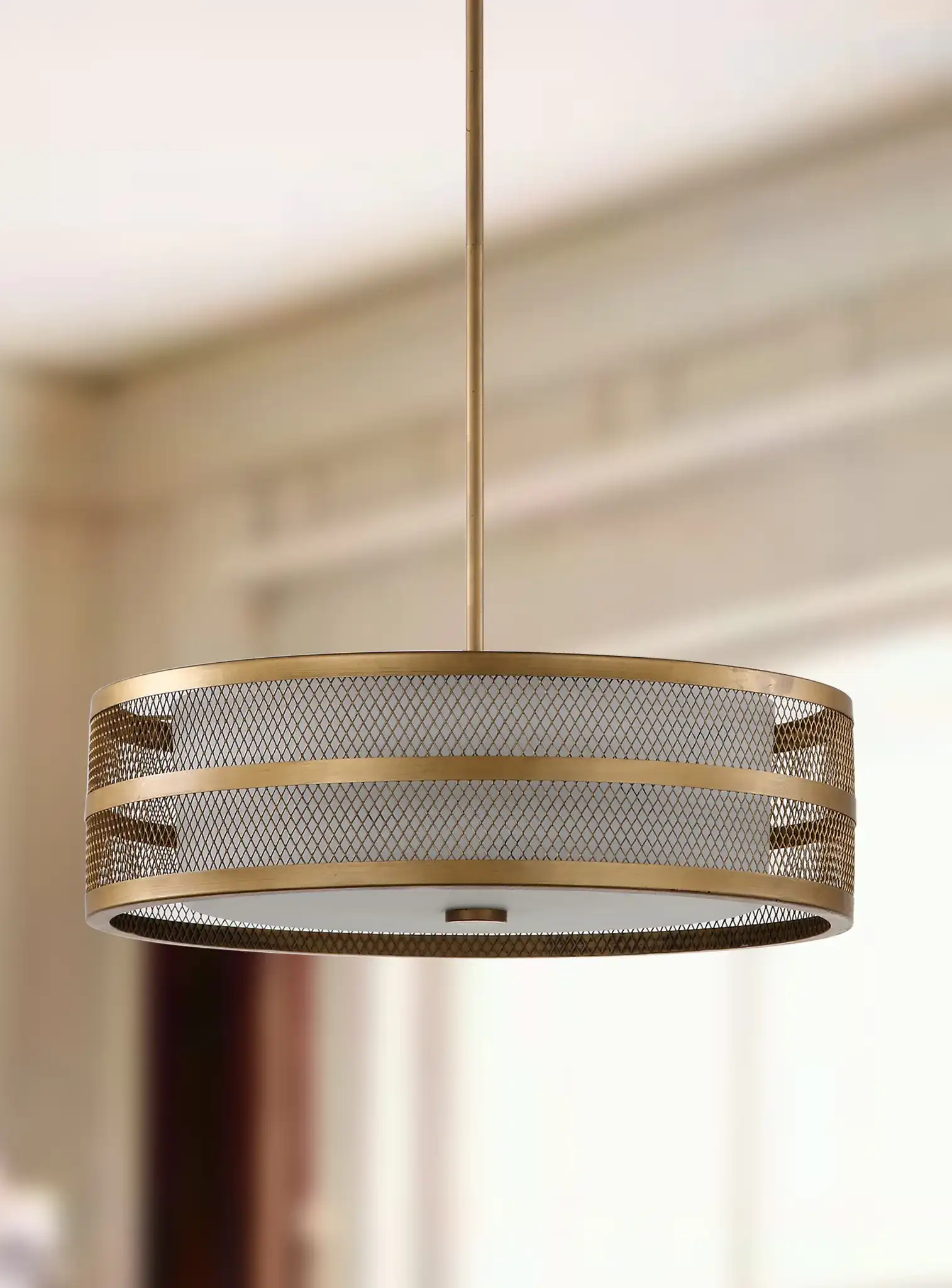 Greta Veil Pendant Light in Antique Gold in a styled room