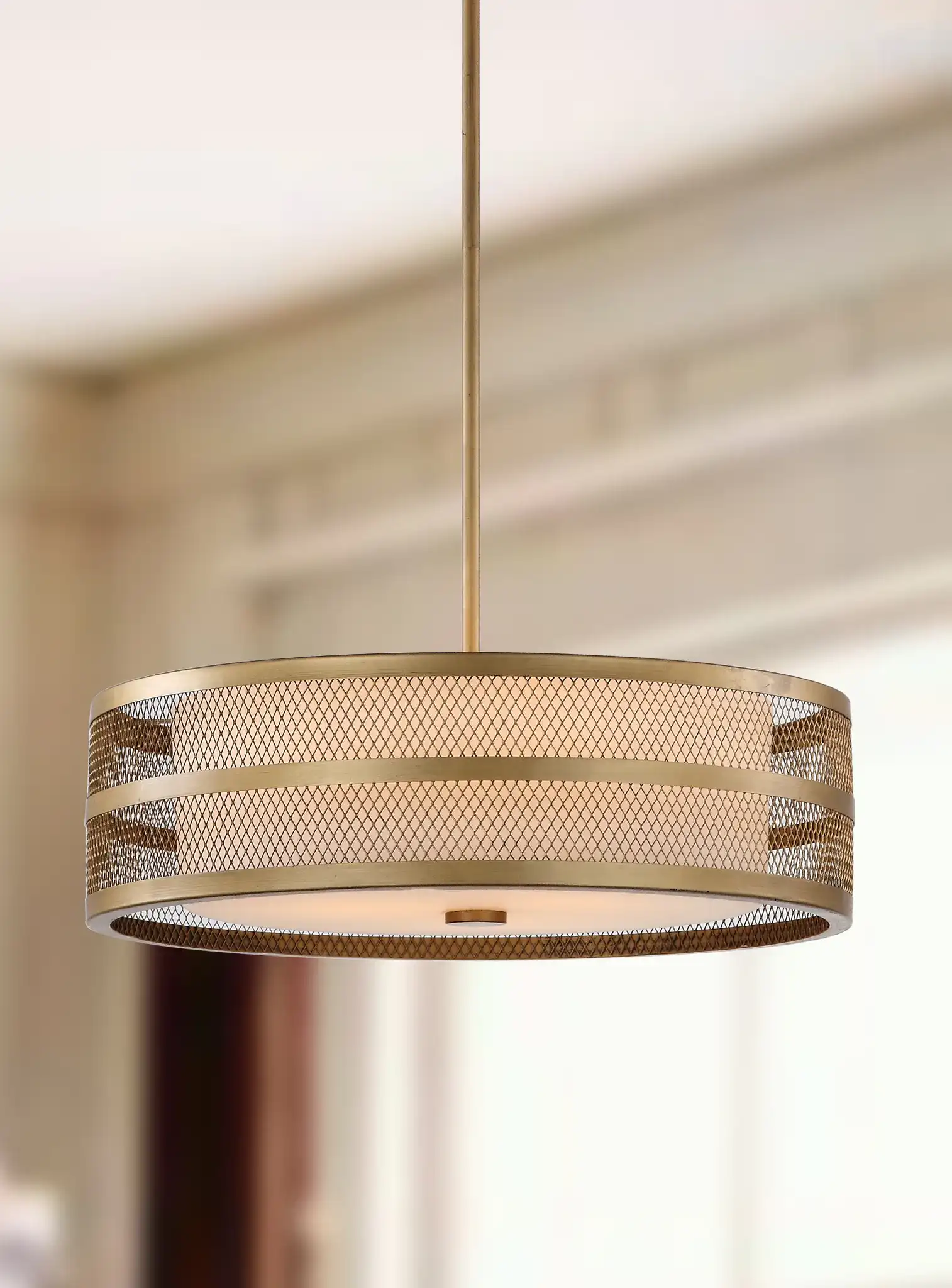 Greta Veil Pendant Light in Antique Gold in a styled room