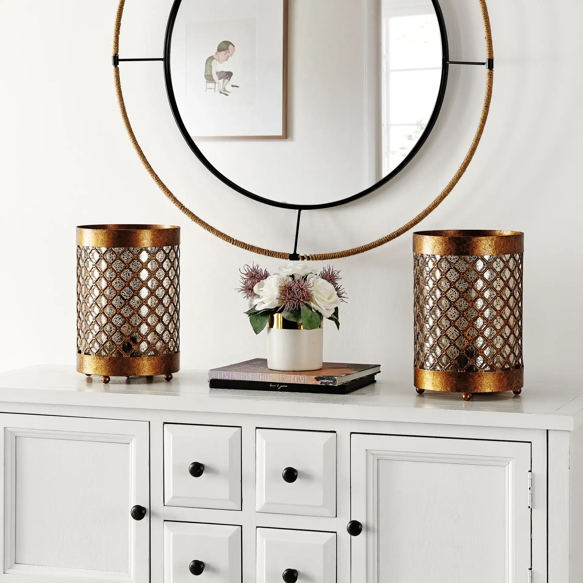 Borden Hurricane Lamp (Set of 2) in Gold in a styled room