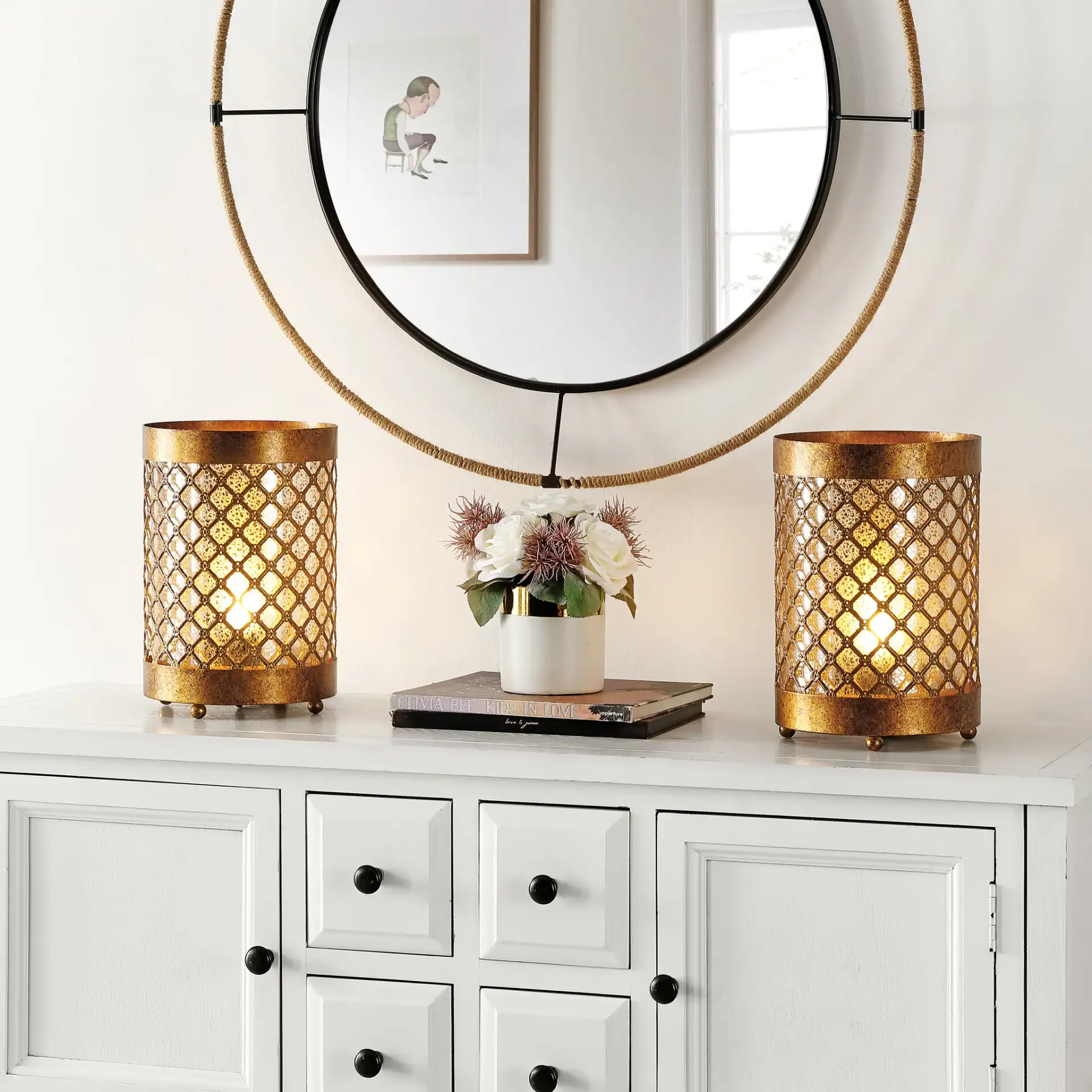 Borden Hurricane Lamp (Set of 2) in Gold in a styled room