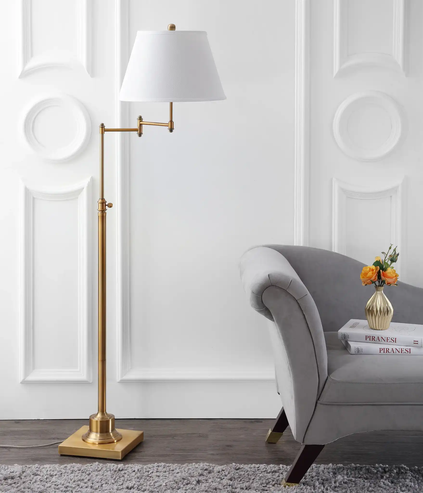 Ingram Swing Floor Lamp in Brass in a styled room