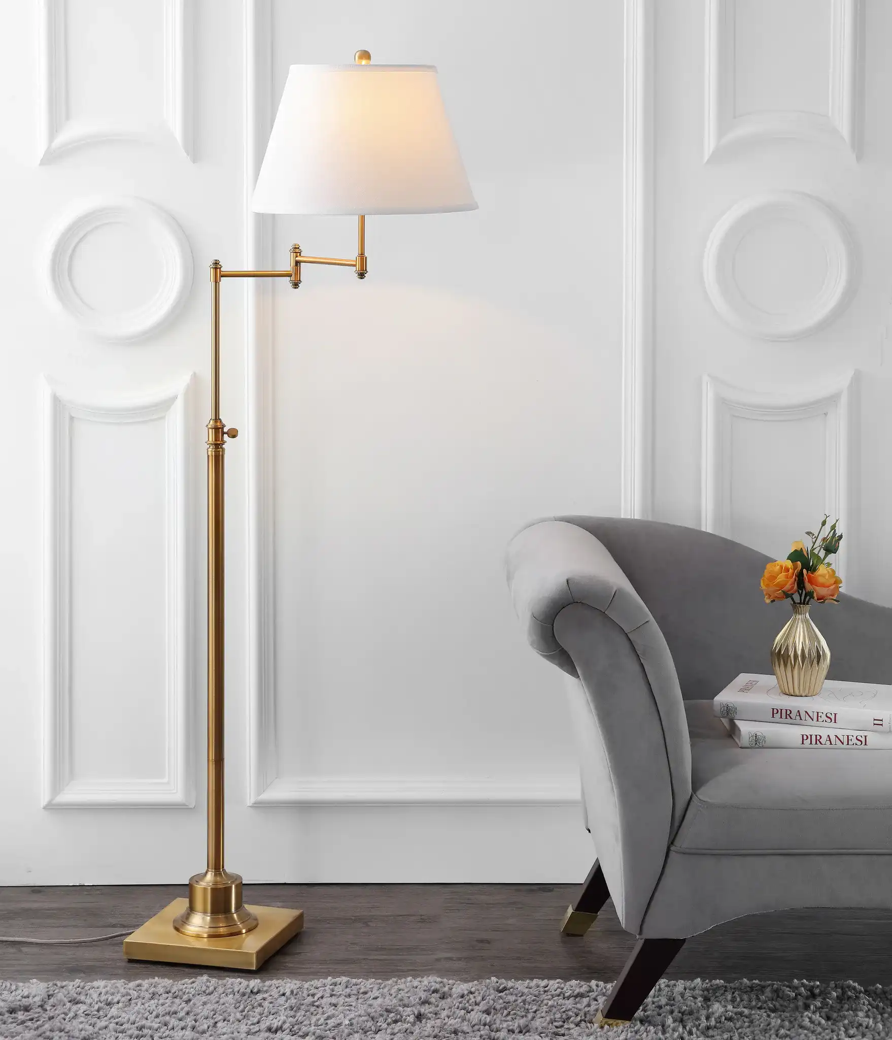 Ingram Swing Floor Lamp in Brass in a styled room