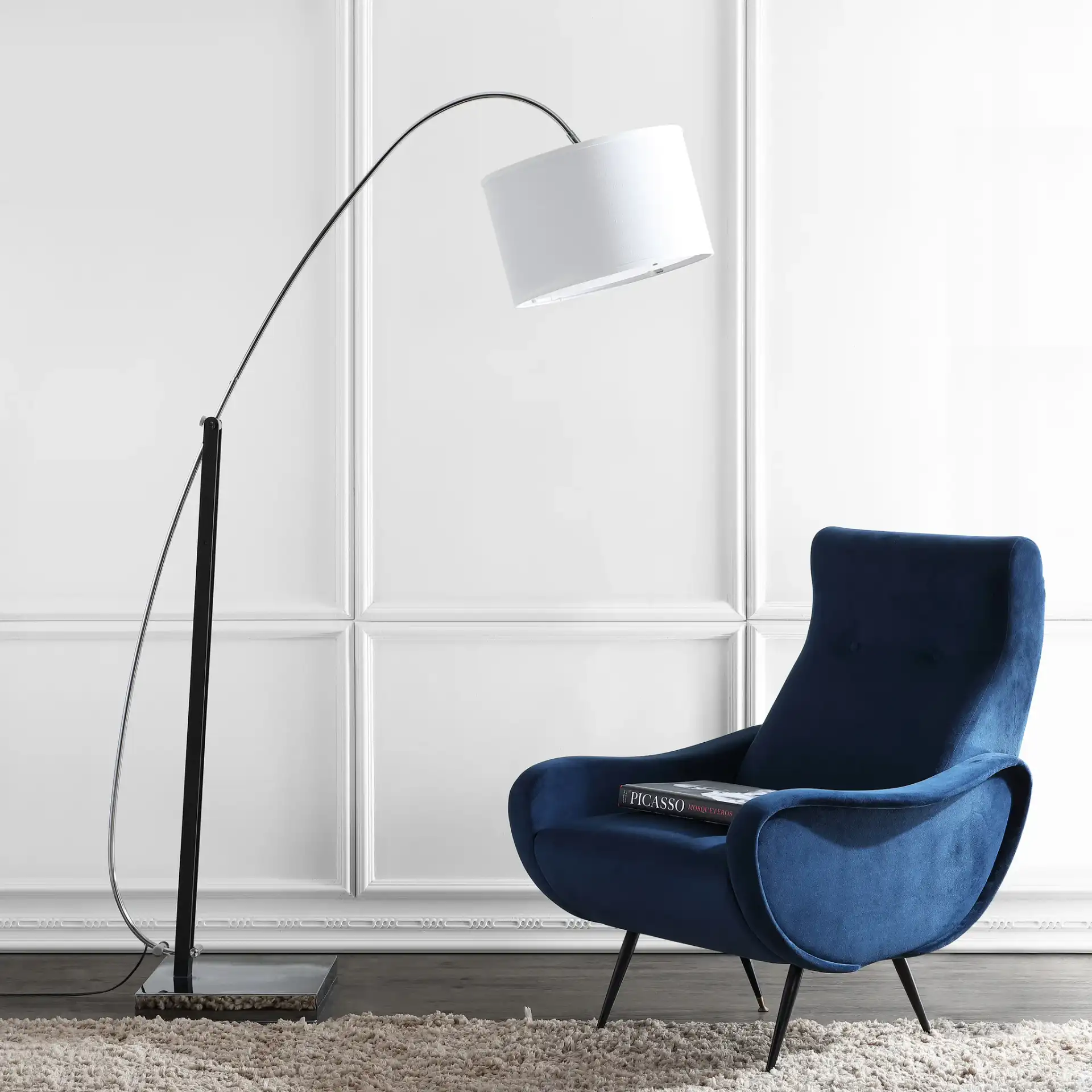 Lyra Arc Floor Lamp in Chrome in a styled room