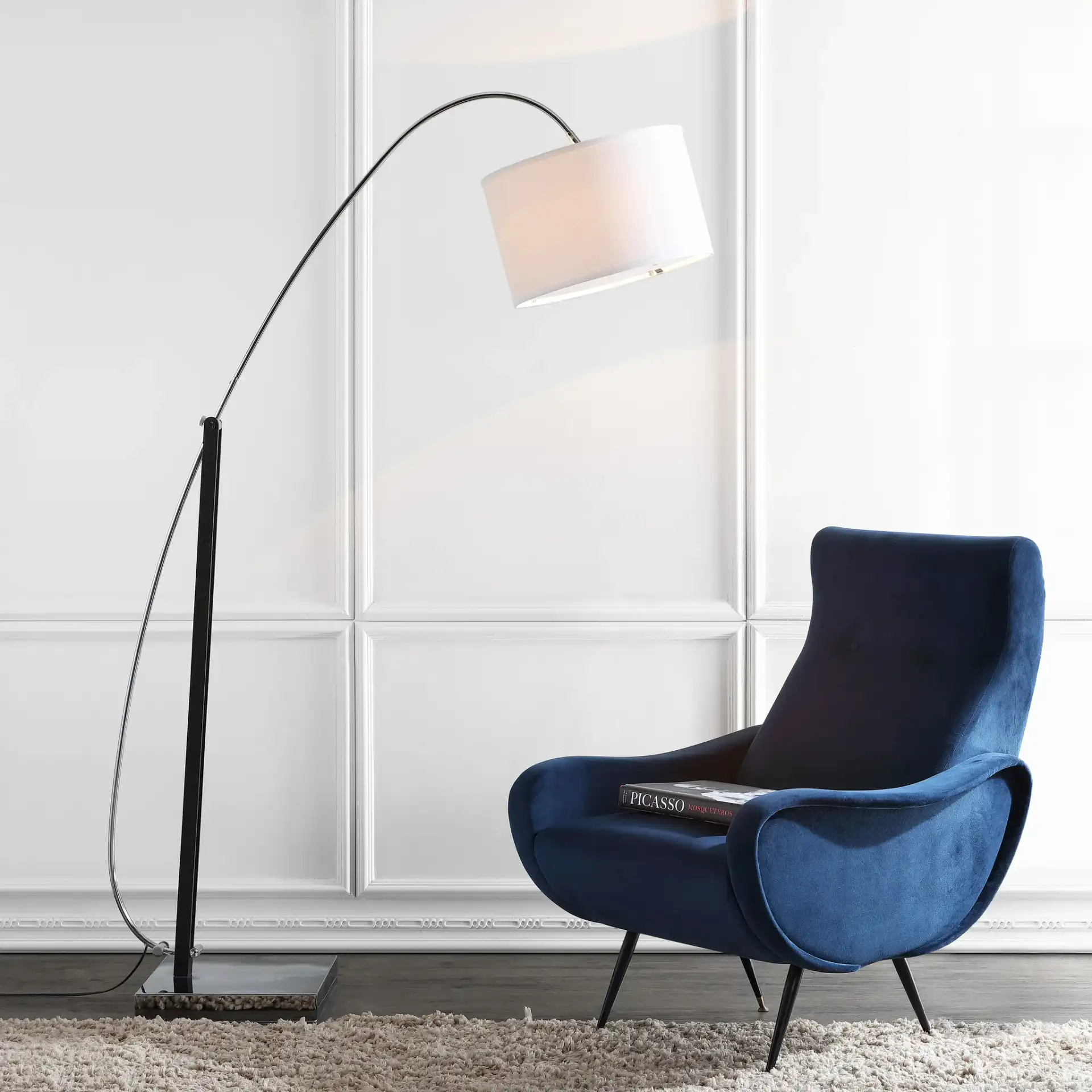 Lyra Arc Floor Lamp in Chrome in a styled room