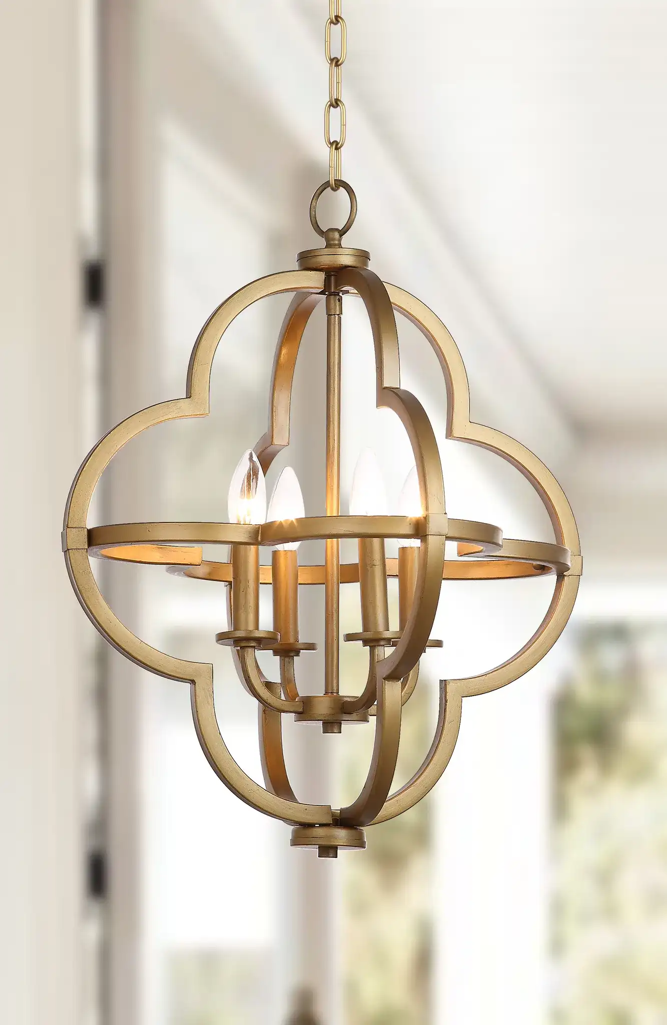 Millard Orb Pendant in Gold in a styled room