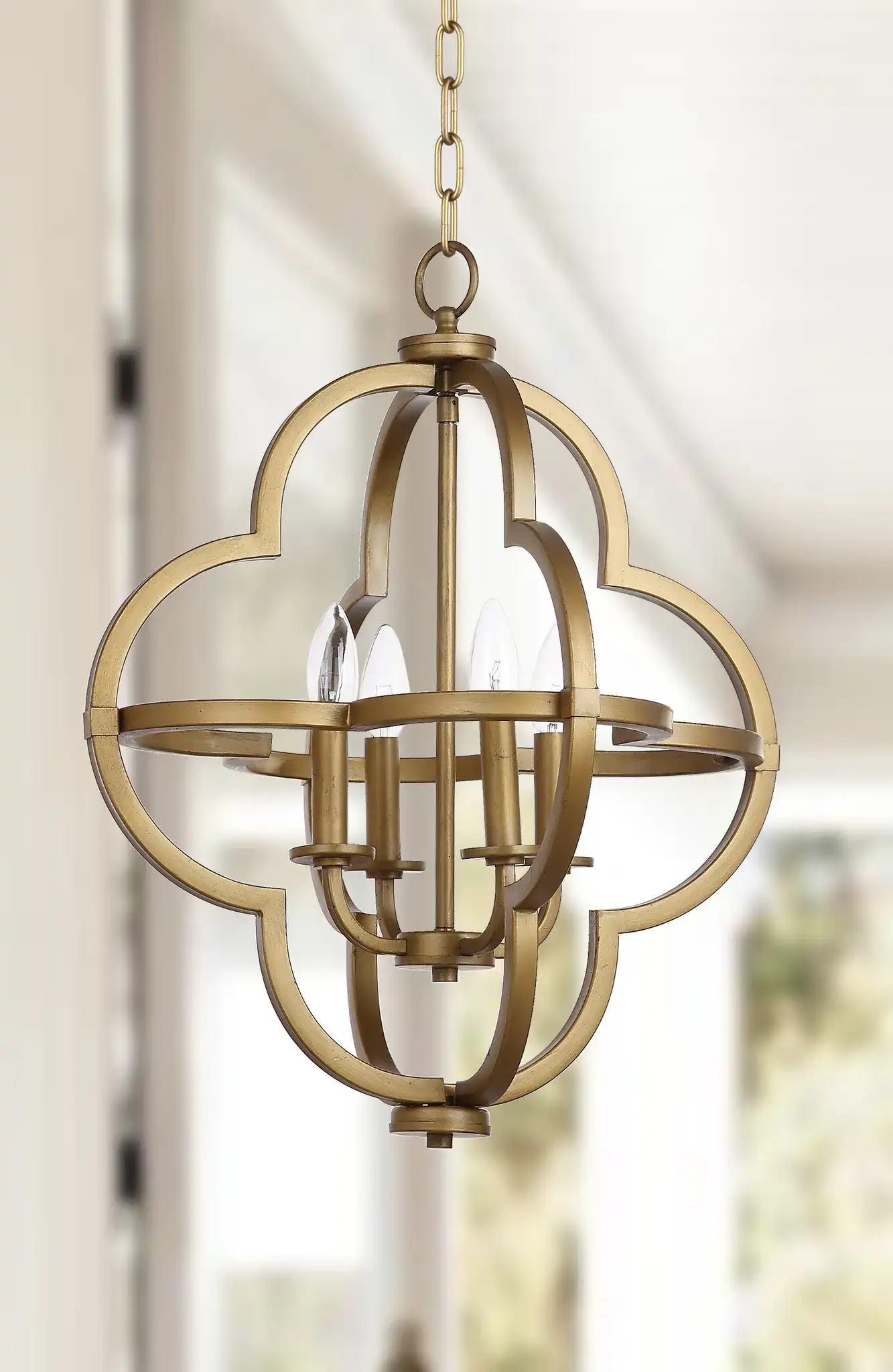 Millard Orb Pendant in Gold in a styled room