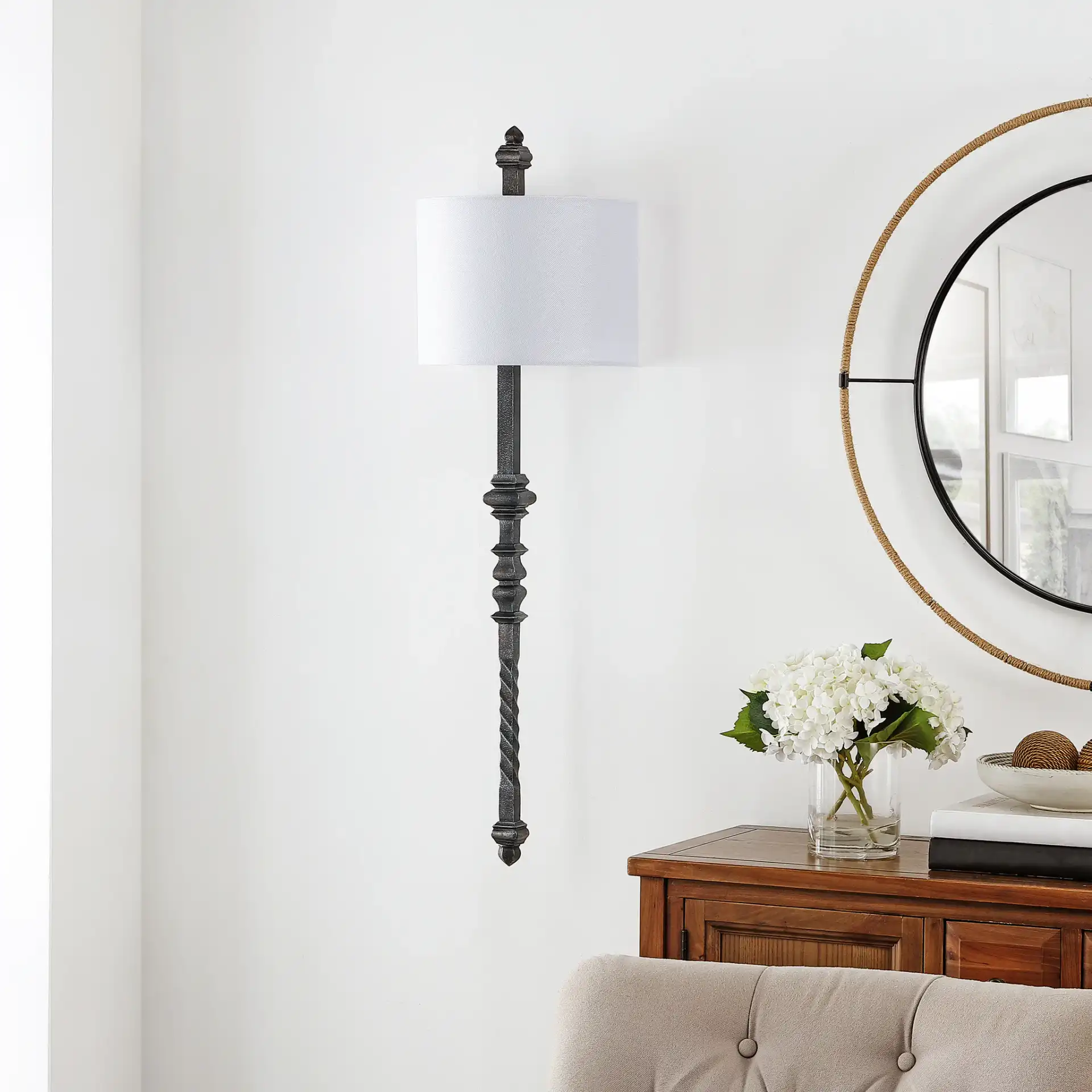 Covington Wall Sconce in Black in a styled room