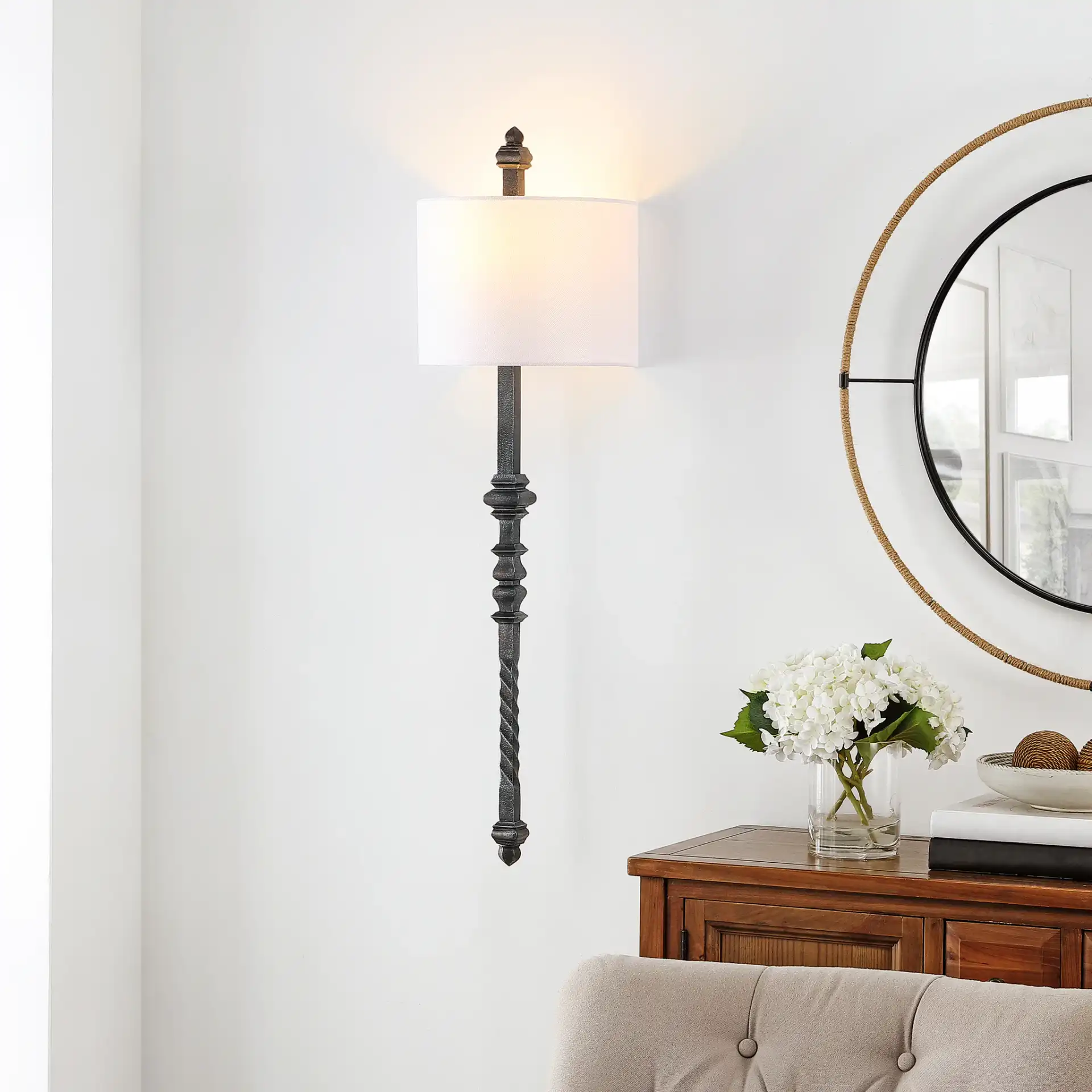 Covington Wall Sconce in Black in a styled room