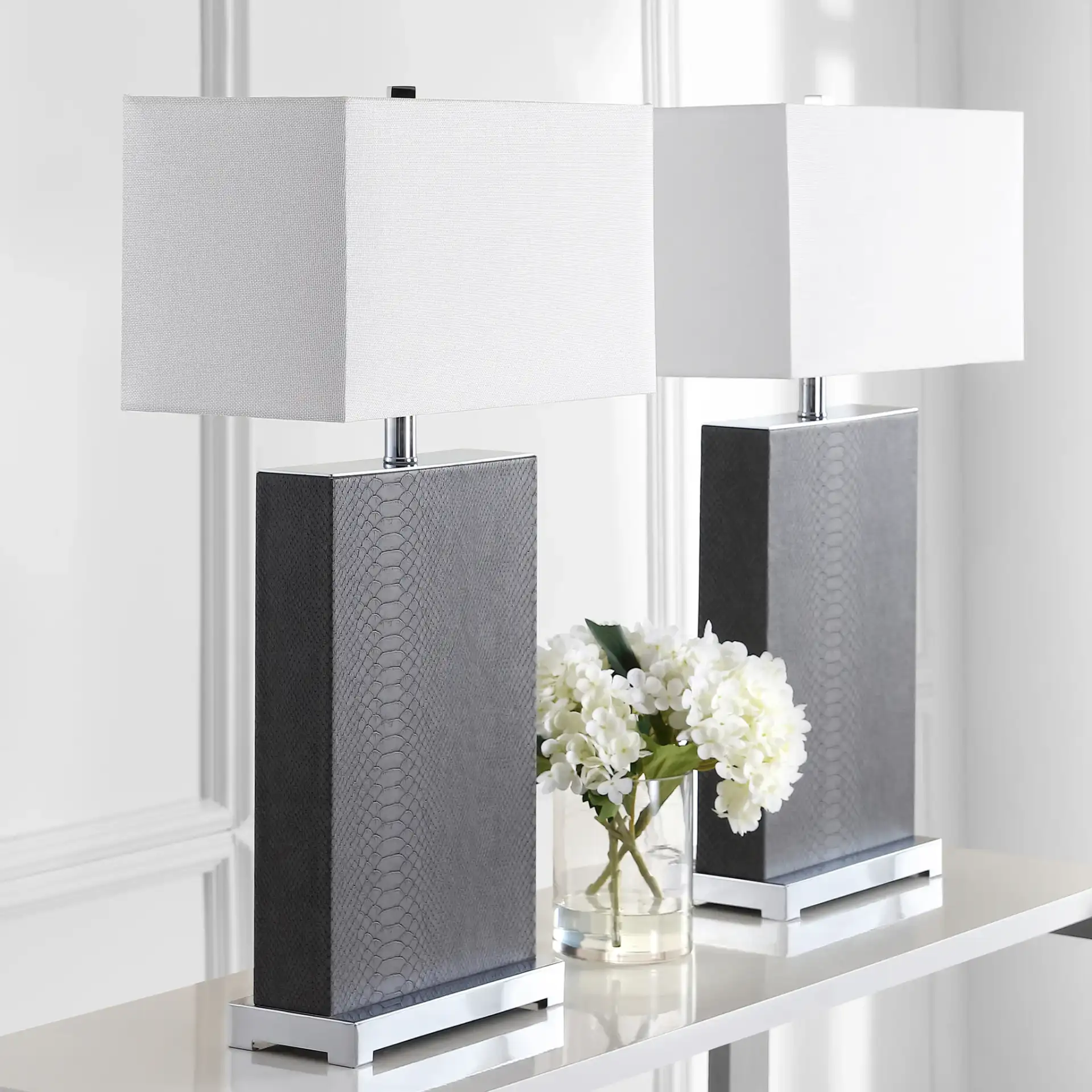 Joyce Table Lamp (Set Of 2) in Cream Faux Snakeskin in a styled room