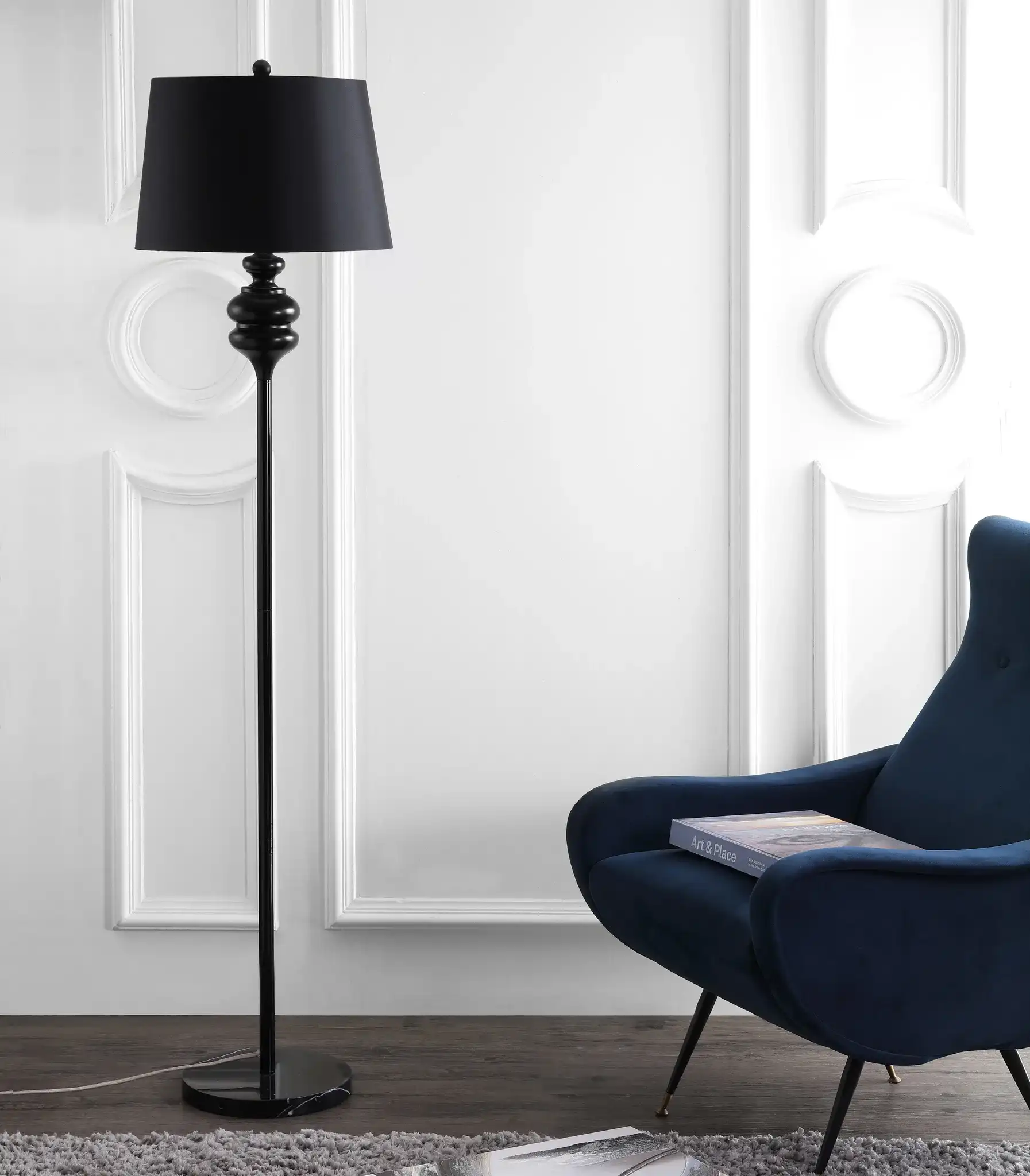 Torc Floor Lamp in White in a styled room