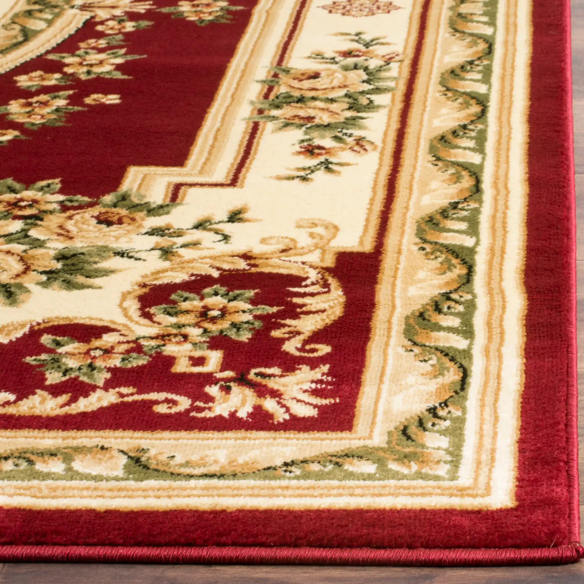 Lyndhurst Oval Floral Medallion Rug in Red / Ivory in a styled room