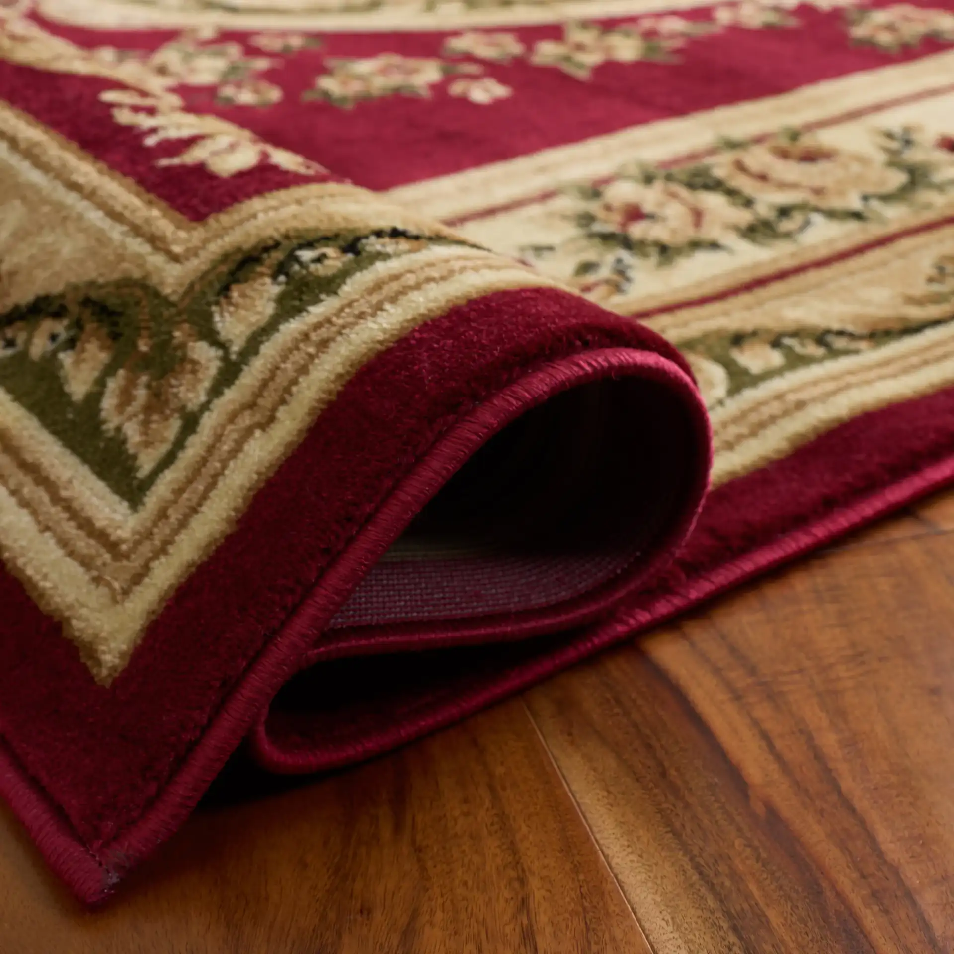 Lyndhurst Oval Floral Medallion Rug in Red / Ivory in a styled room
