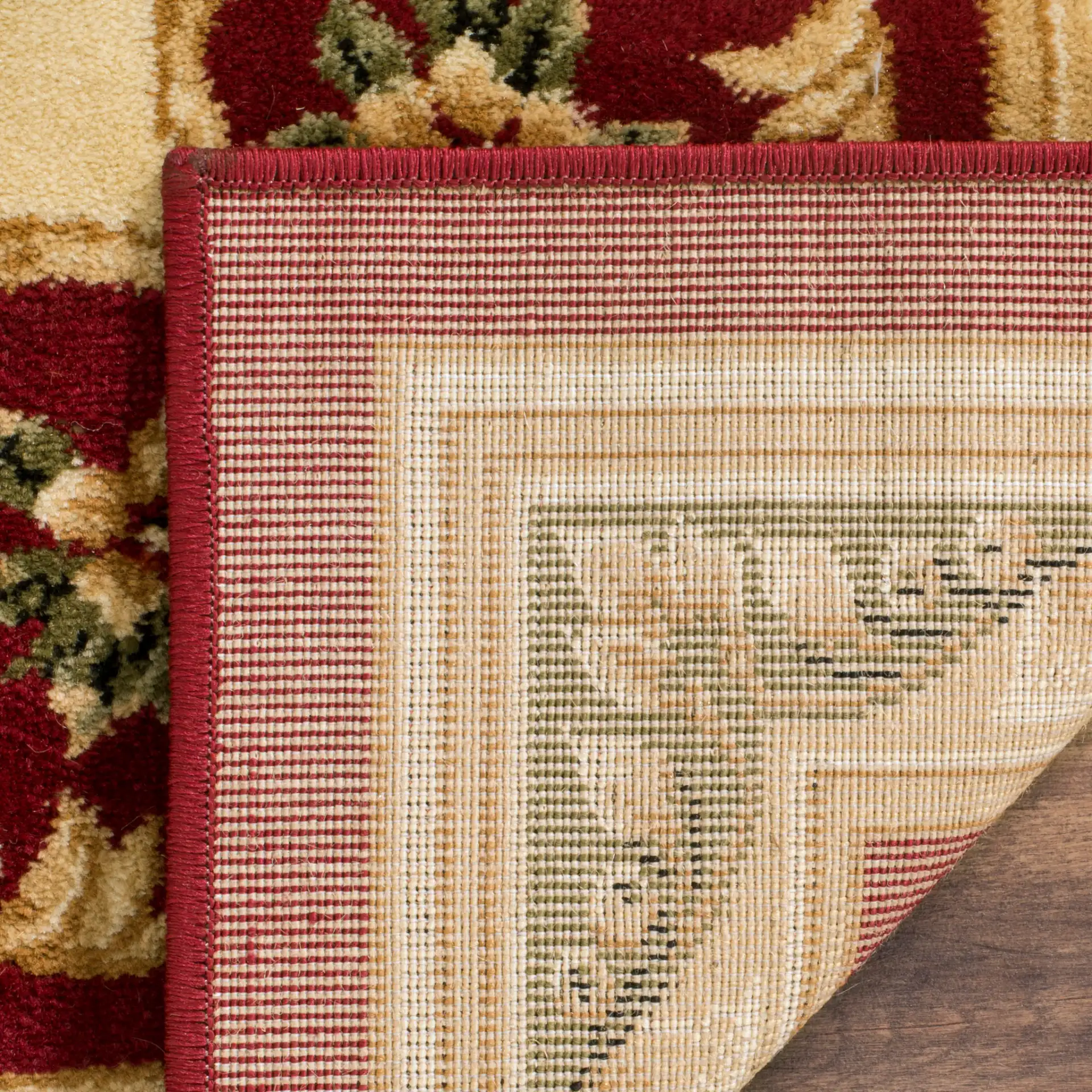 Lyndhurst Oval Floral Medallion Rug in Red / Ivory in a styled room