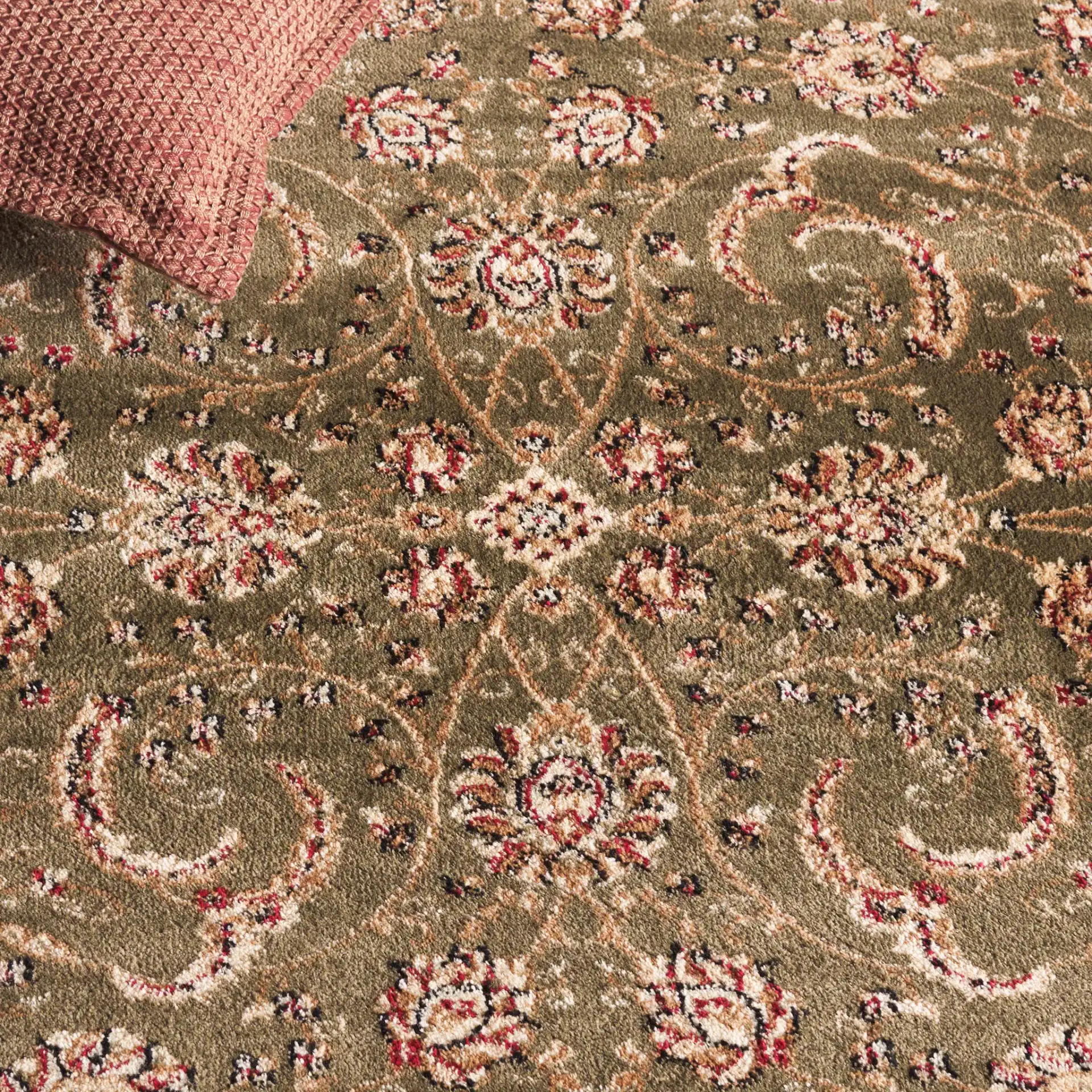 Lyndhurst Arabesque Bordered Rug in Sage / Ivory in a styled room