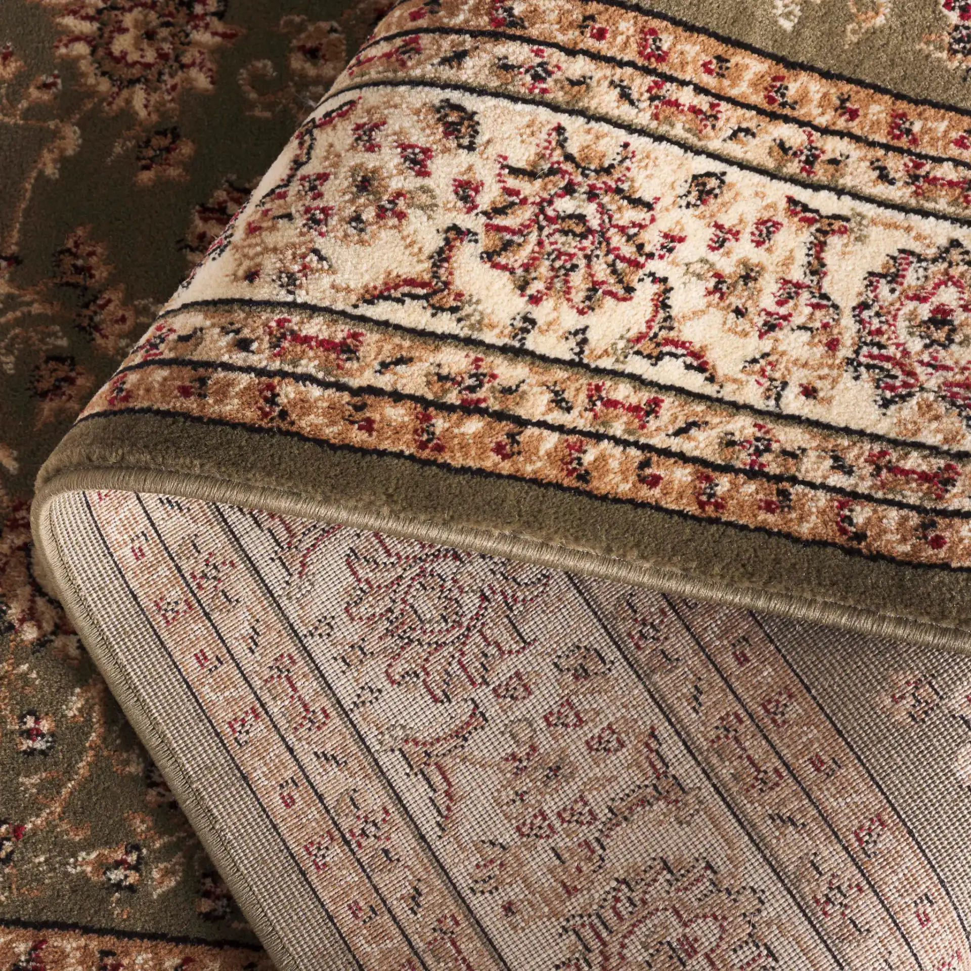 Lyndhurst Arabesque Bordered Rug in Sage / Ivory in a styled room