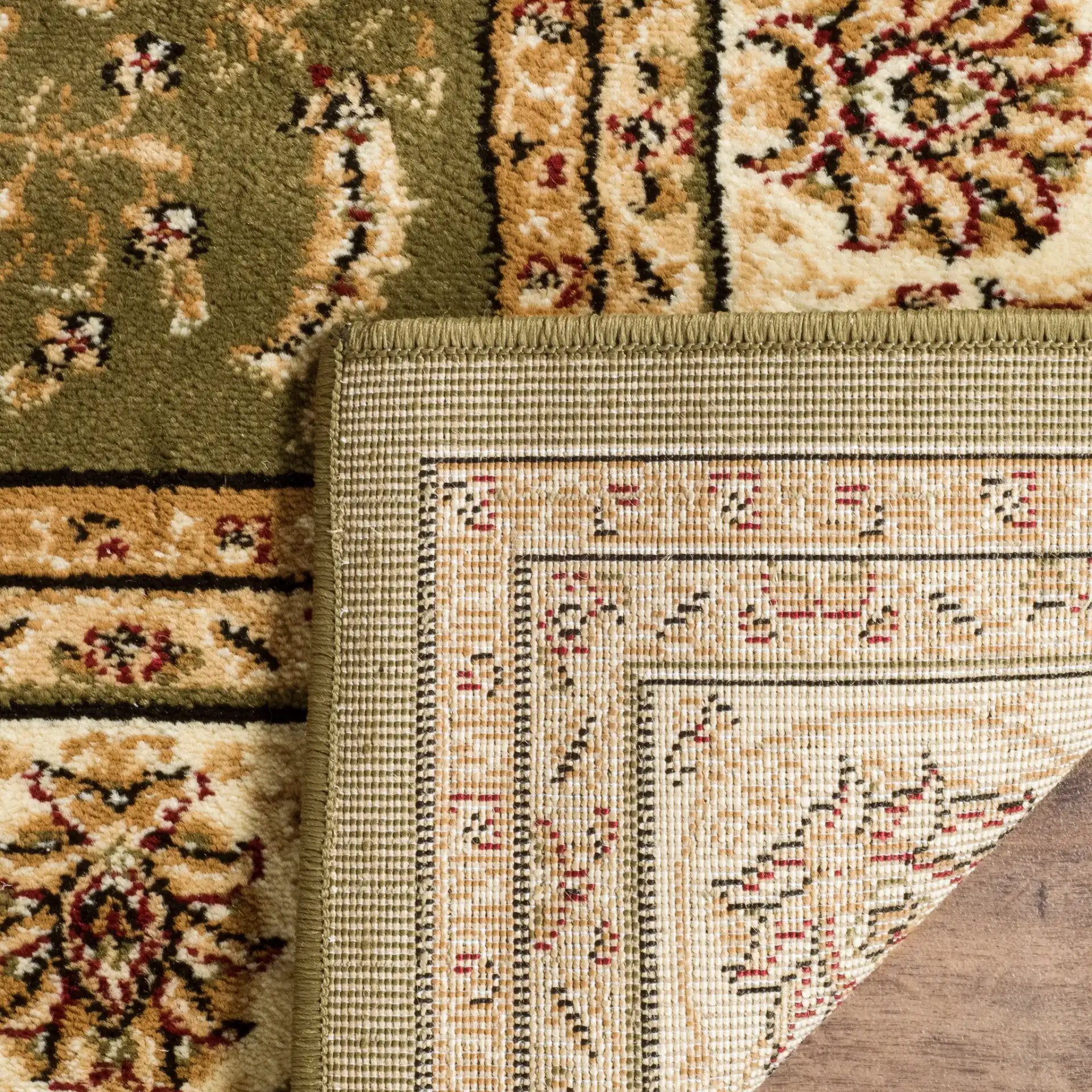 Lyndhurst Arabesque Bordered Rug in Sage / Ivory in a styled room