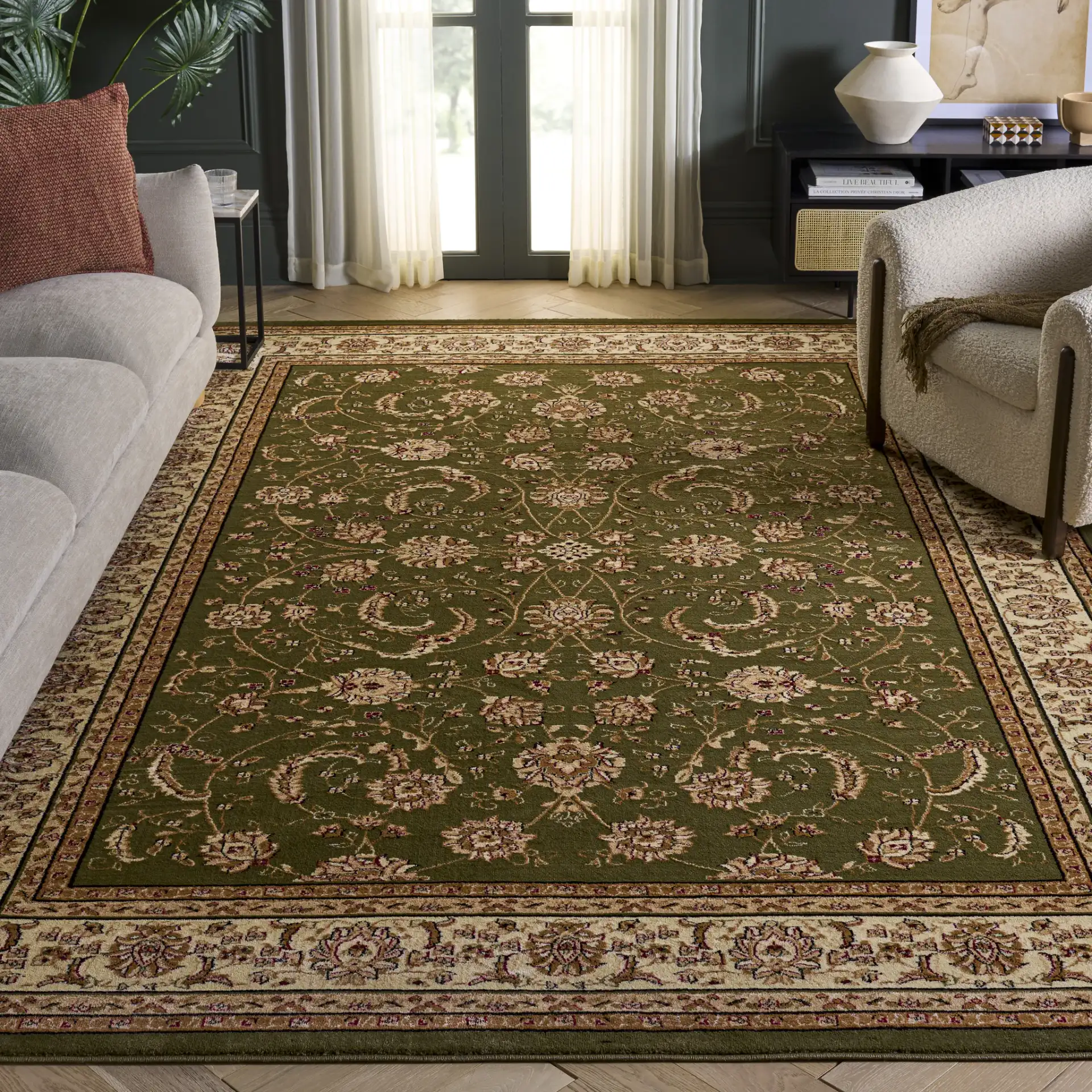 Lyndhurst Arabesque Bordered Rug in Sage / Ivory in a styled room
