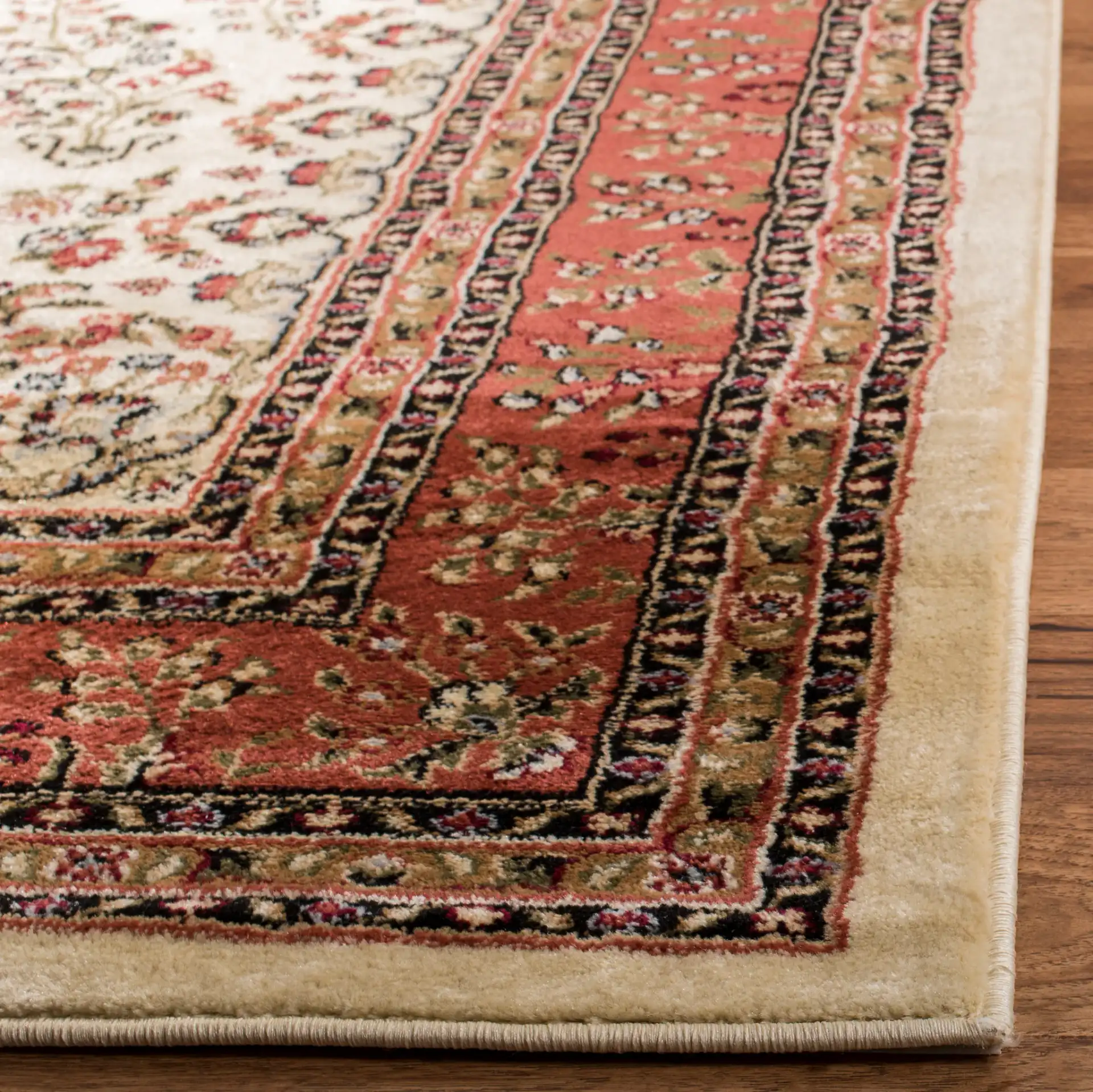 Lyndhurst Bordered Floral Rug in Ivory / Rust in a styled room