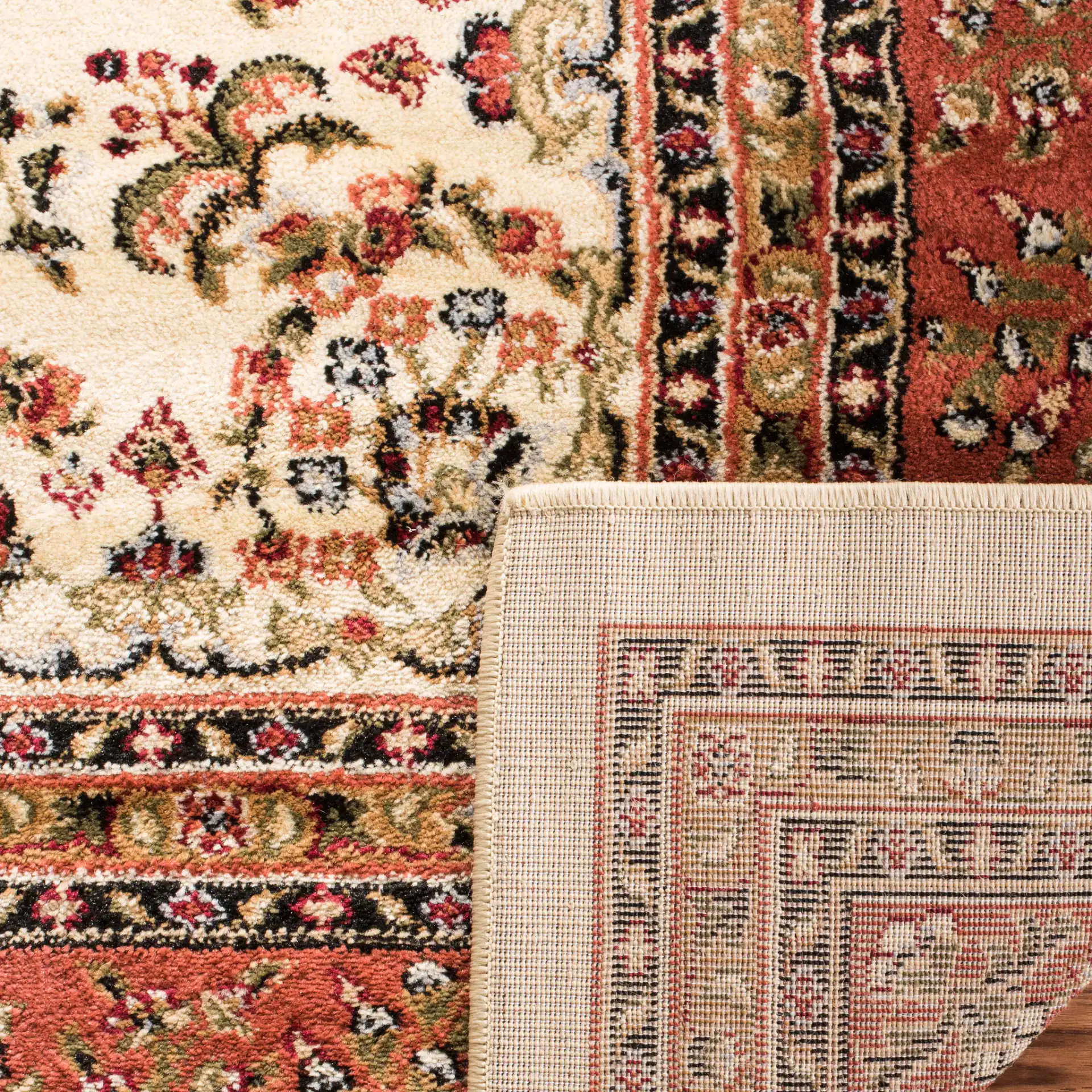 Lyndhurst Bordered Floral Rug in Ivory / Rust in a styled room