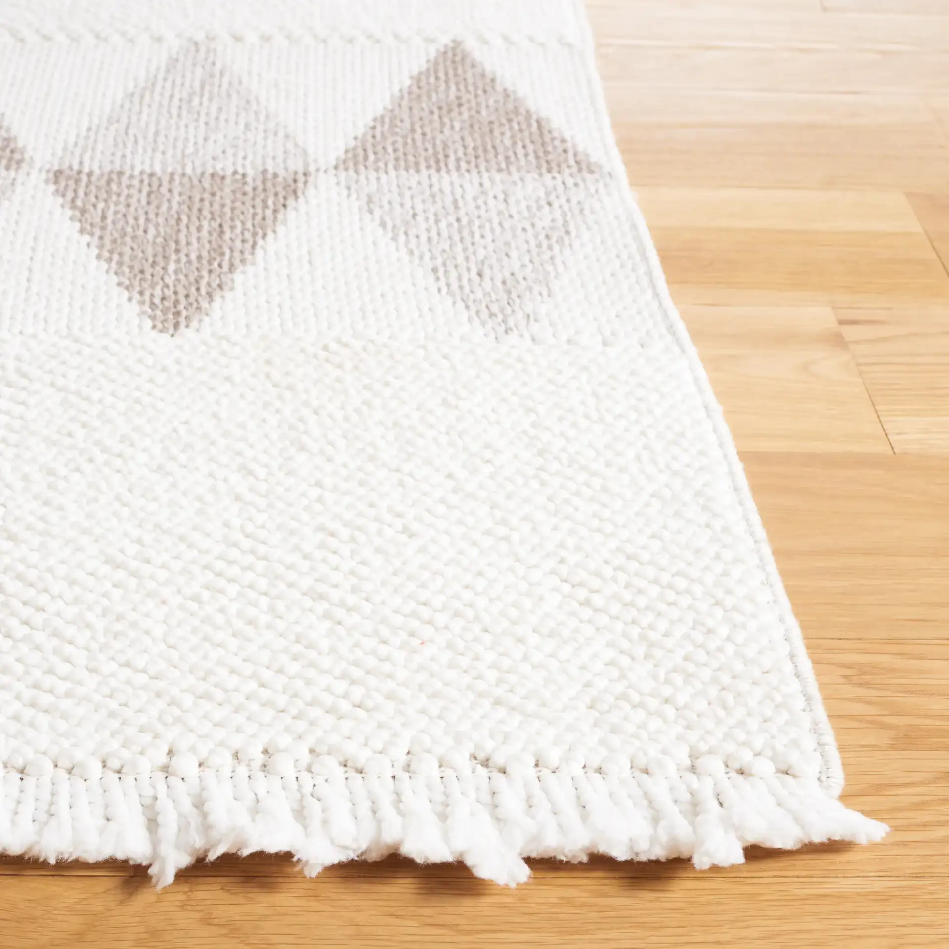 Lotus Banded Chevron Rug in Ivory / Beige in a styled room