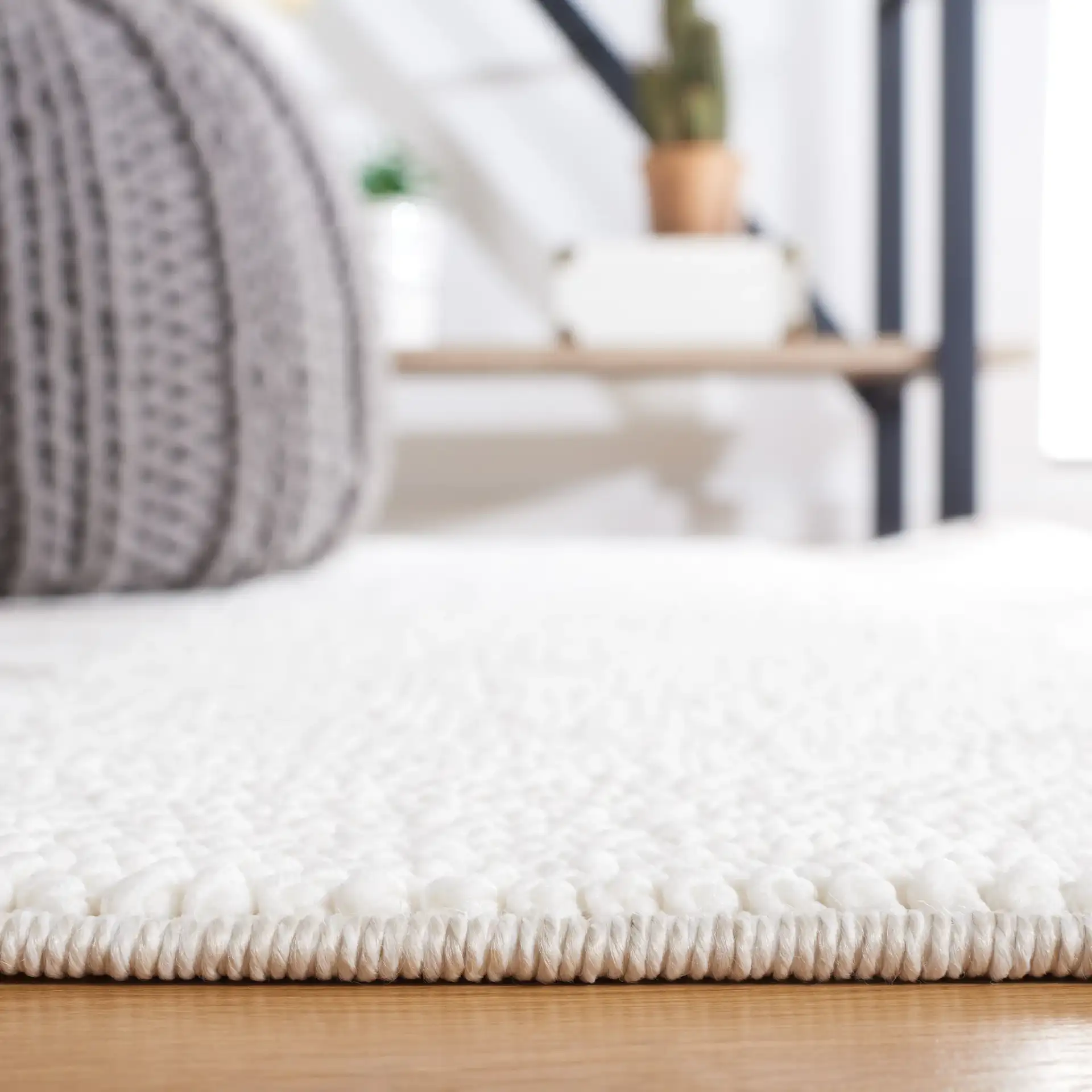 Lotus Banded Chevron Rug in Ivory / Beige in a styled room