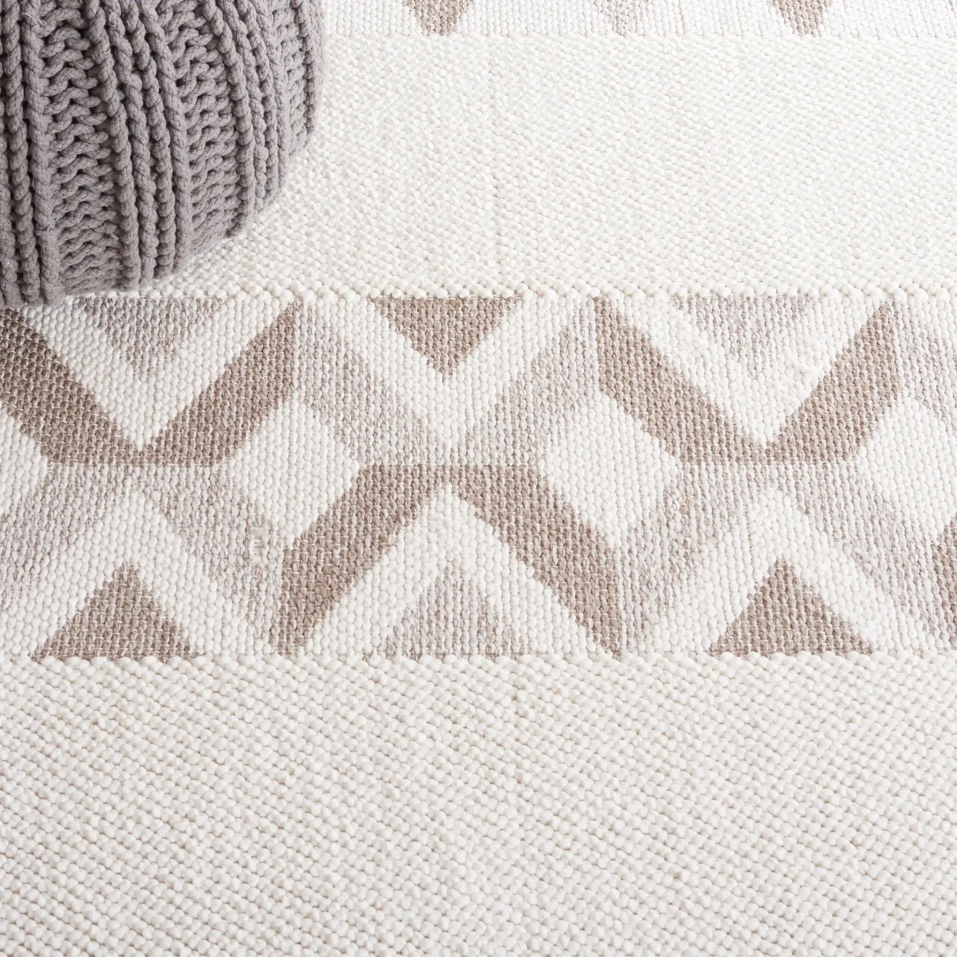 Lotus Banded Chevron Rug in Ivory / Beige in a styled room