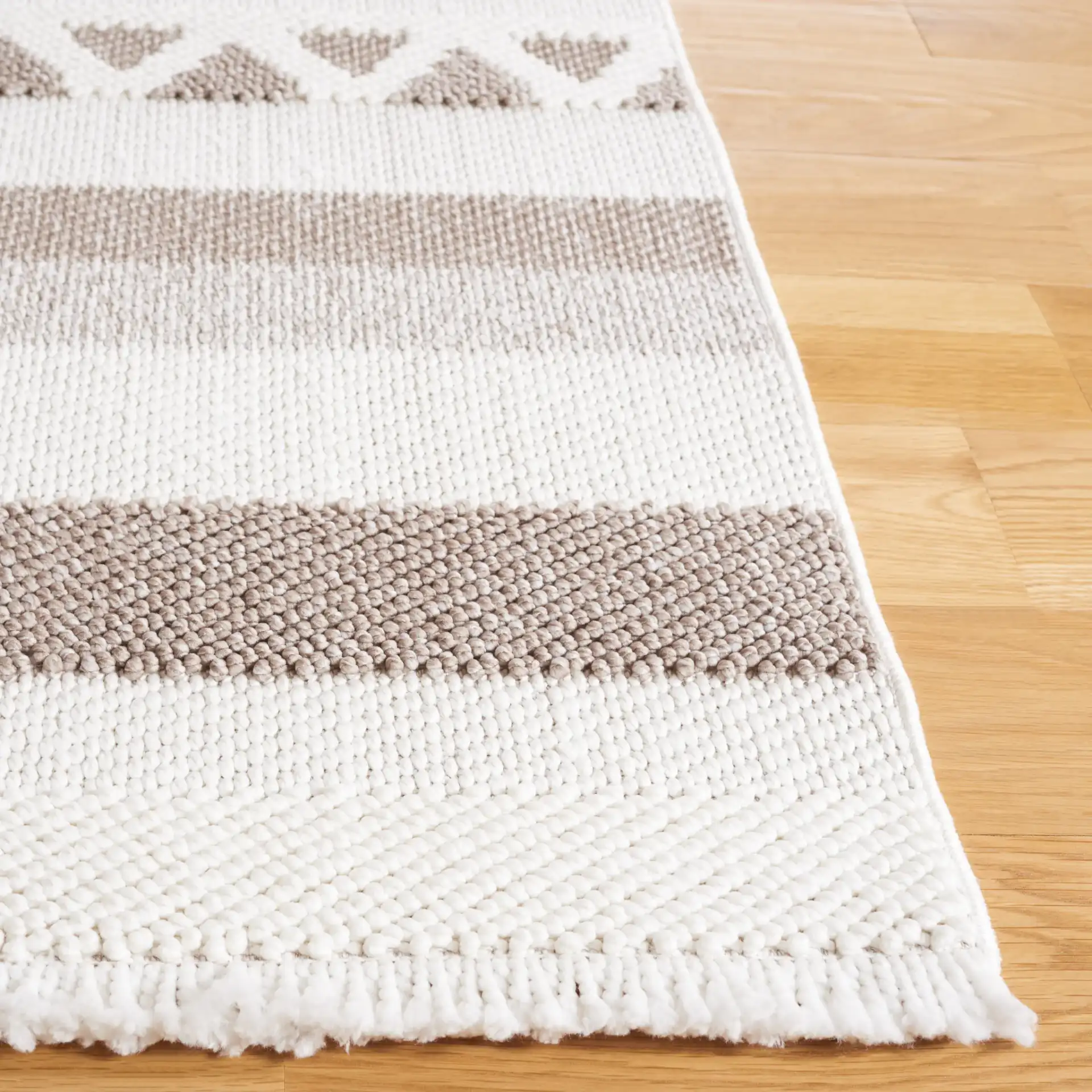 Lotus Banded Diamond Rug in Ivory / Beige in a styled room