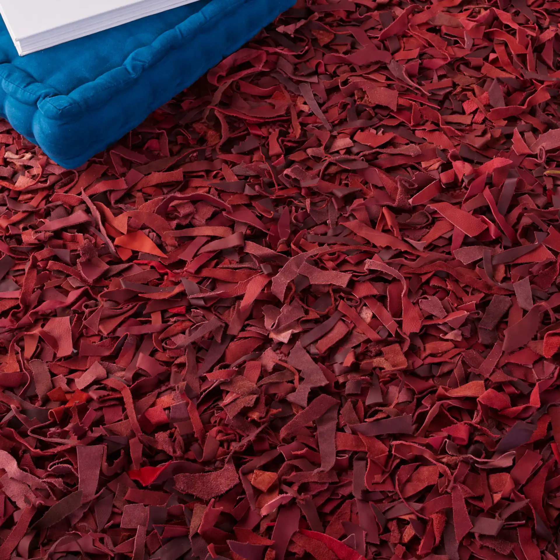 Leather Shag Solid Rug in Red in a styled room