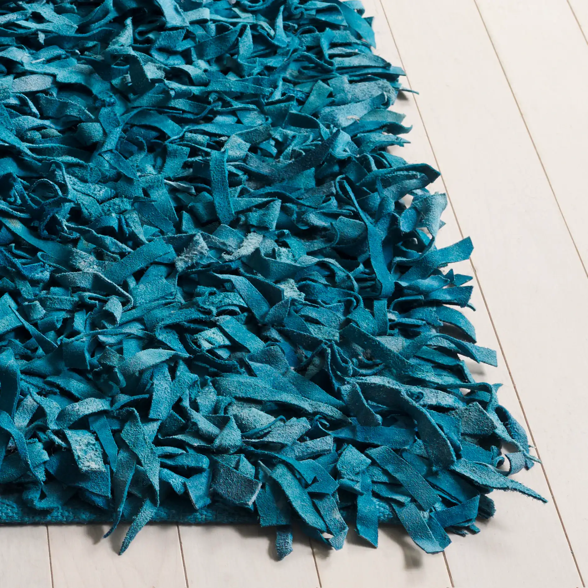 Leather Shag Solid Rug in Light Blue in a styled room