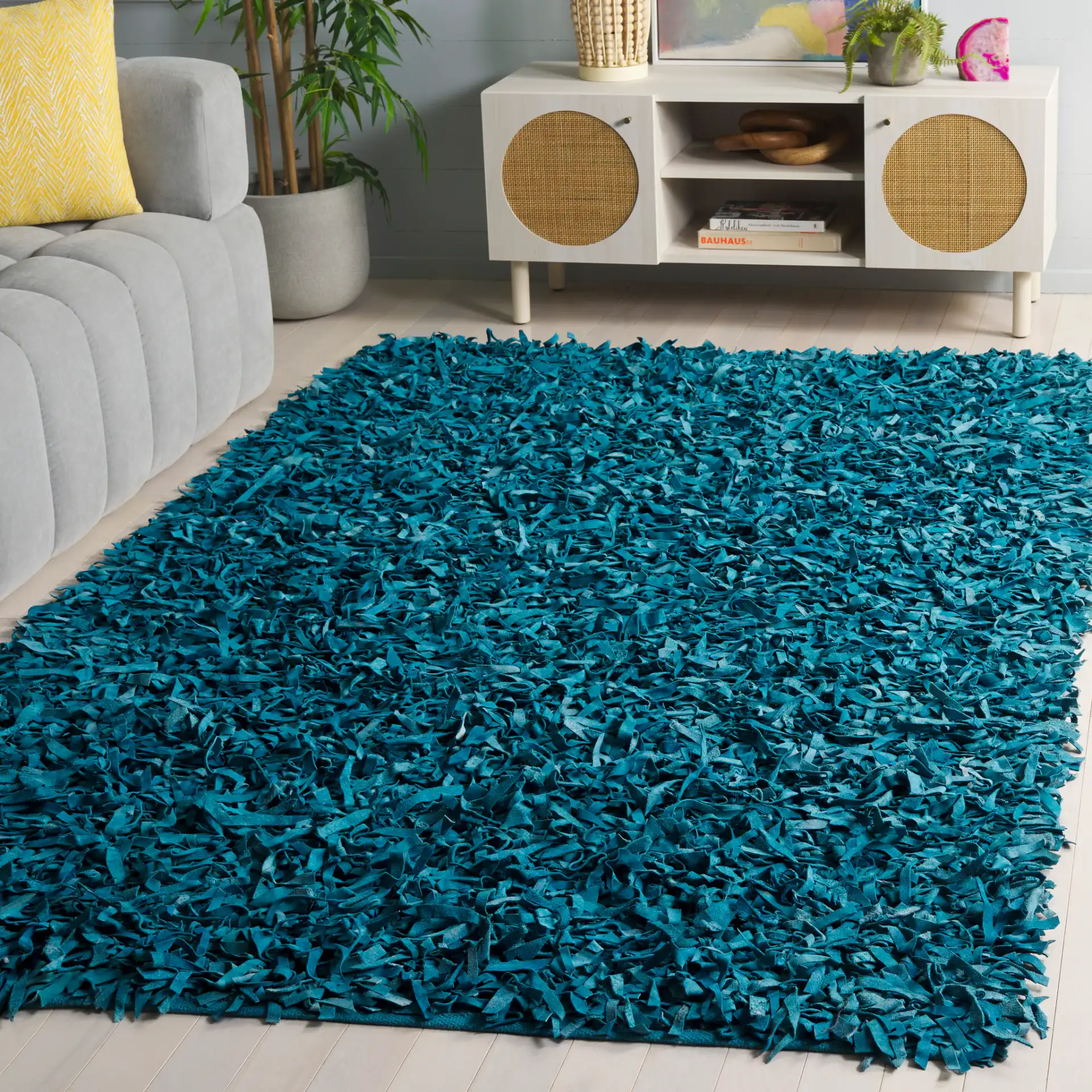 Leather Shag Solid Rug in Light Blue in a styled room