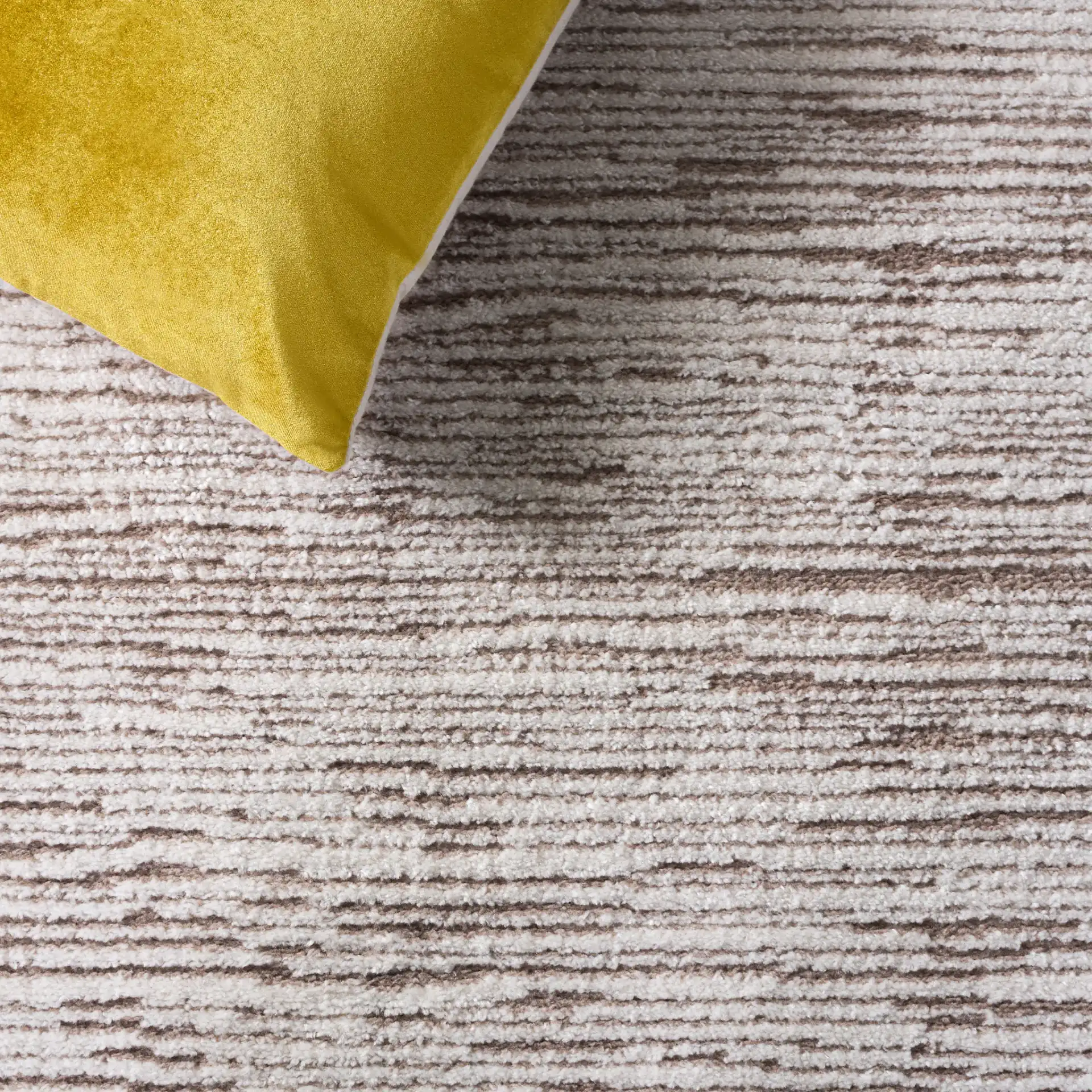 Lunara Striated Line Rug in Beige / Ivory in a styled room