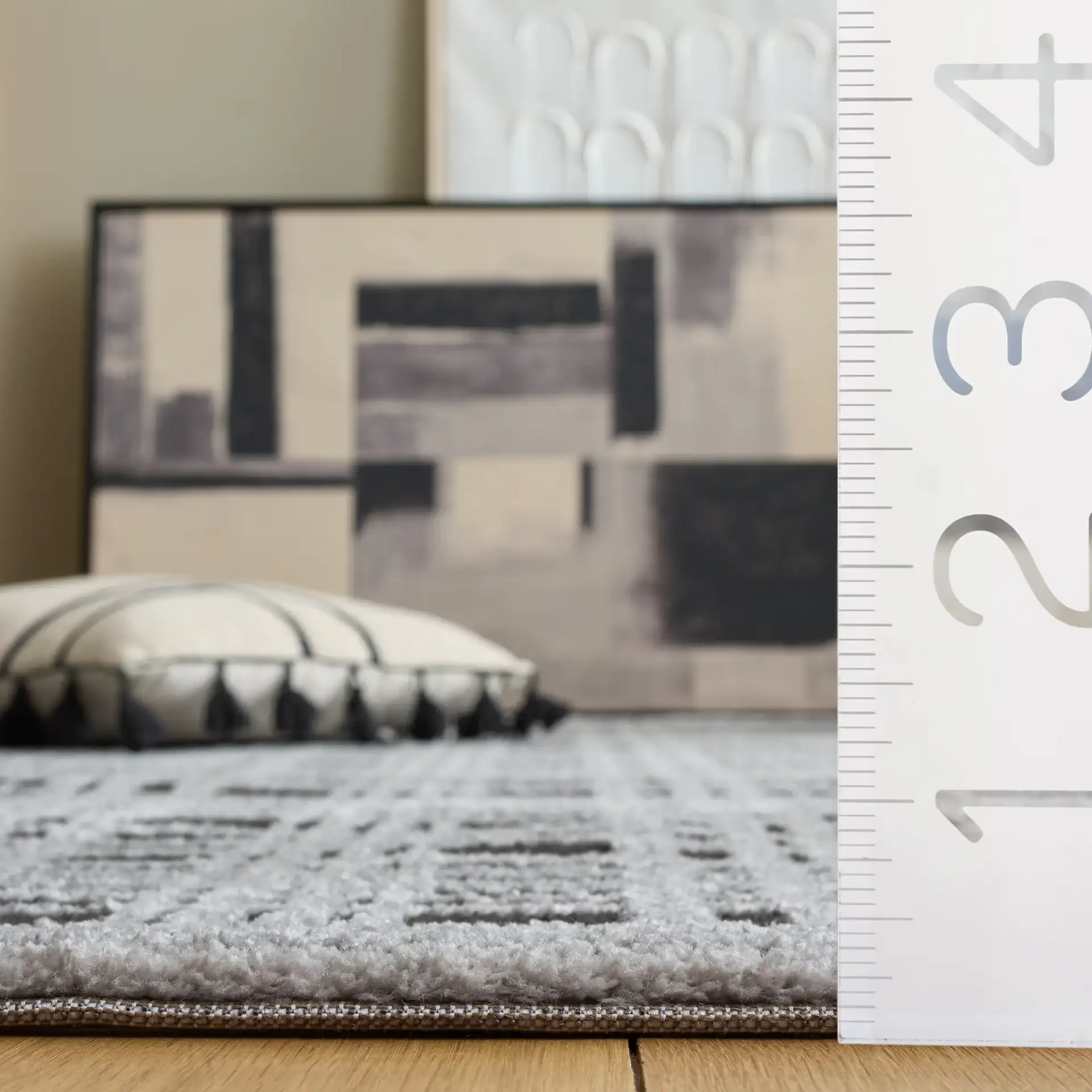 Lunara Plaid Bordered Rug in Black / Ivory in a styled room