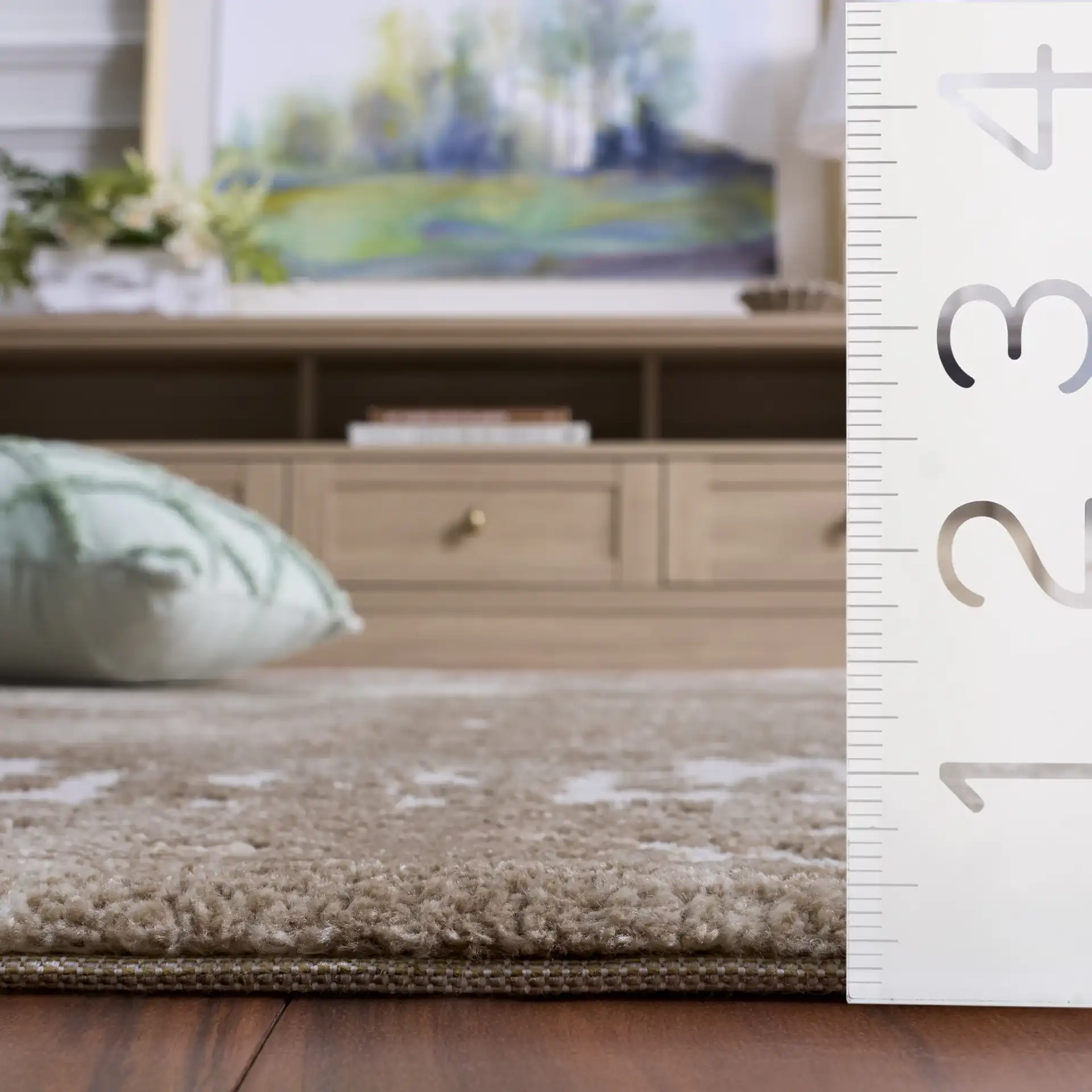 Lunara Abstract Distressed Rug in Beige / Ivory in a styled room