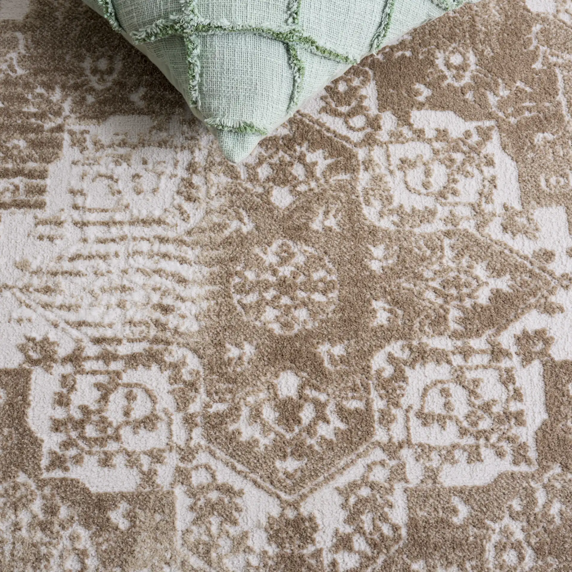 Lunara Abstract Distressed Rug in Beige / Ivory in a styled room