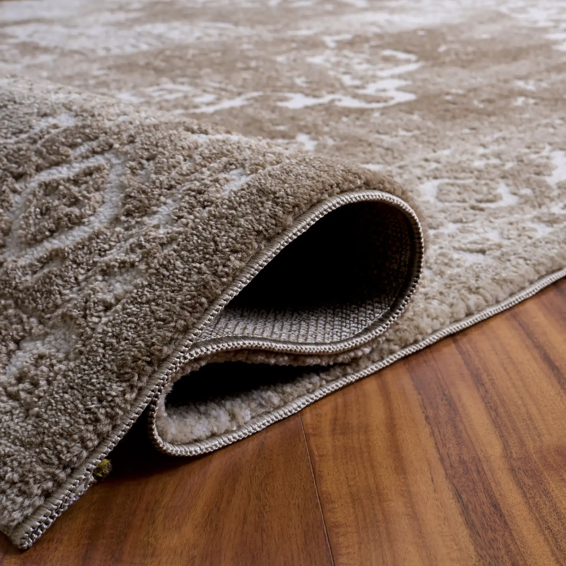 Lunara Abstract Distressed Rug in Beige / Ivory in a styled room