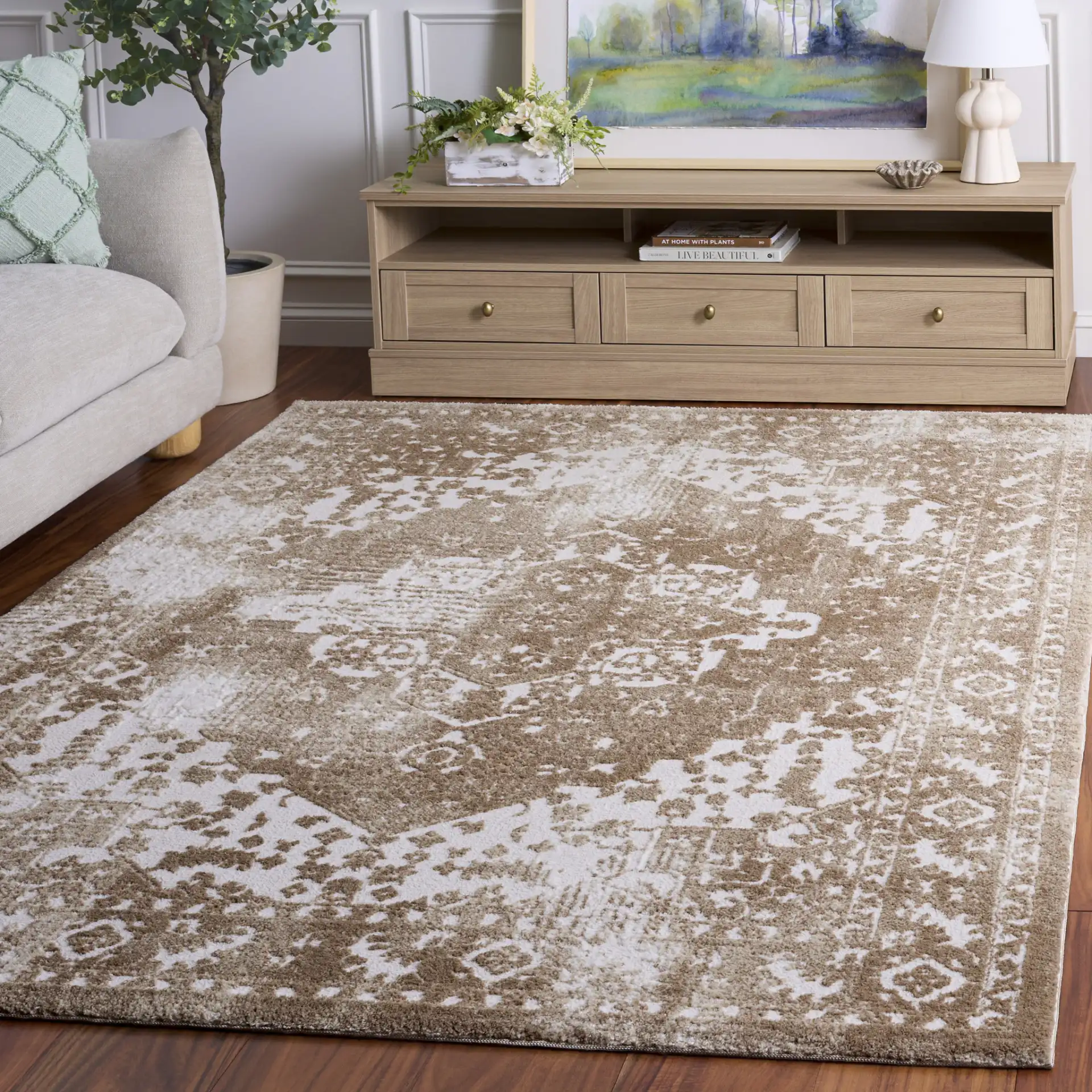 Lunara Abstract Distressed Rug in Beige / Ivory in a styled room