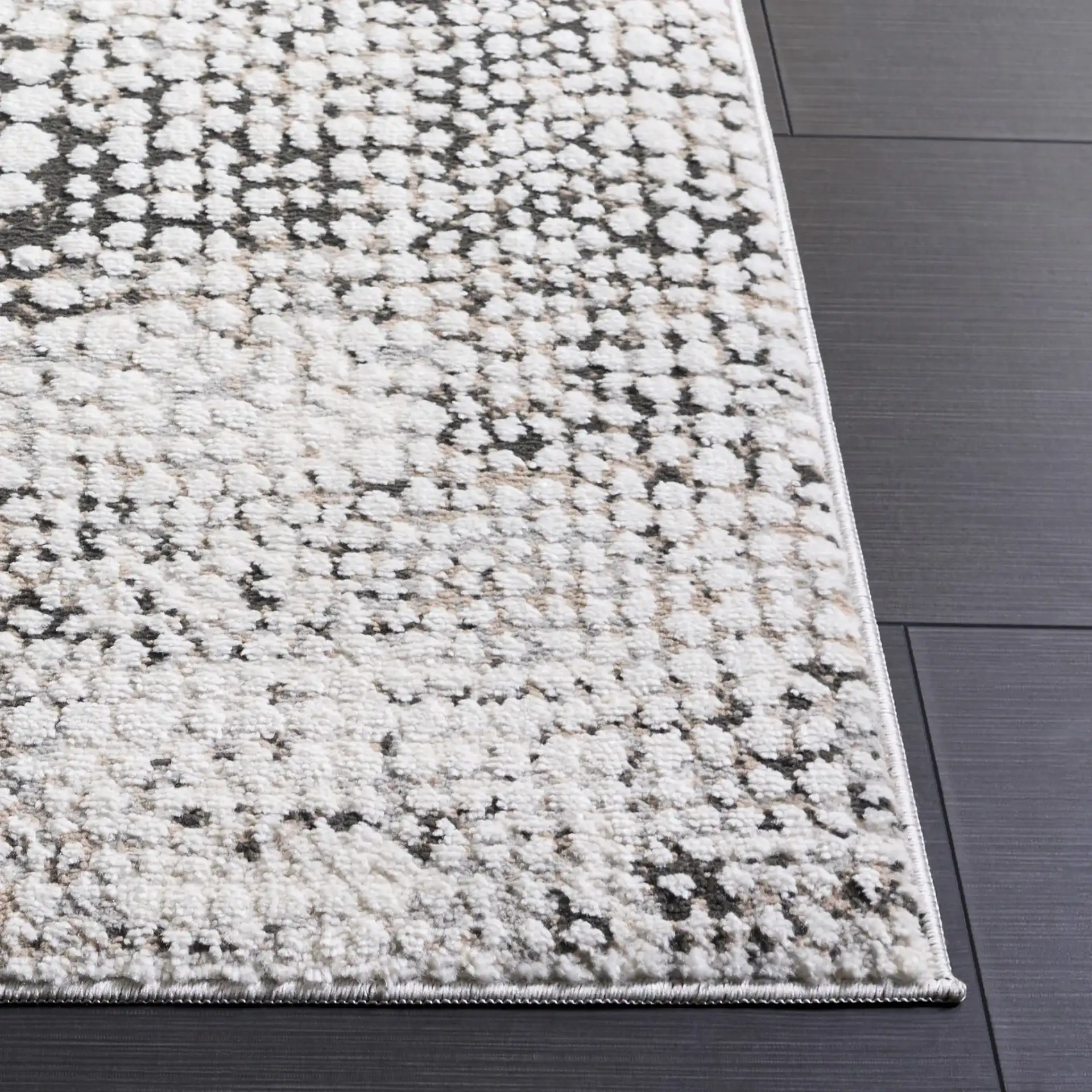Lunara Pebble Mosaic Rug in Charcoal / Ivory in a styled room
