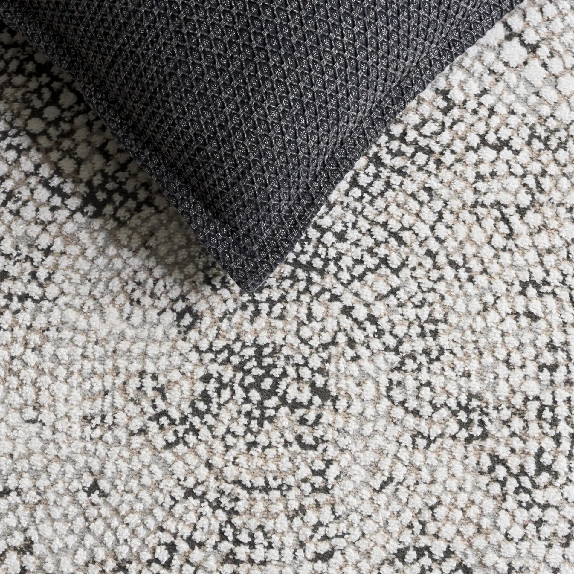 Lunara Pebble Mosaic Rug in Charcoal / Ivory in a styled room