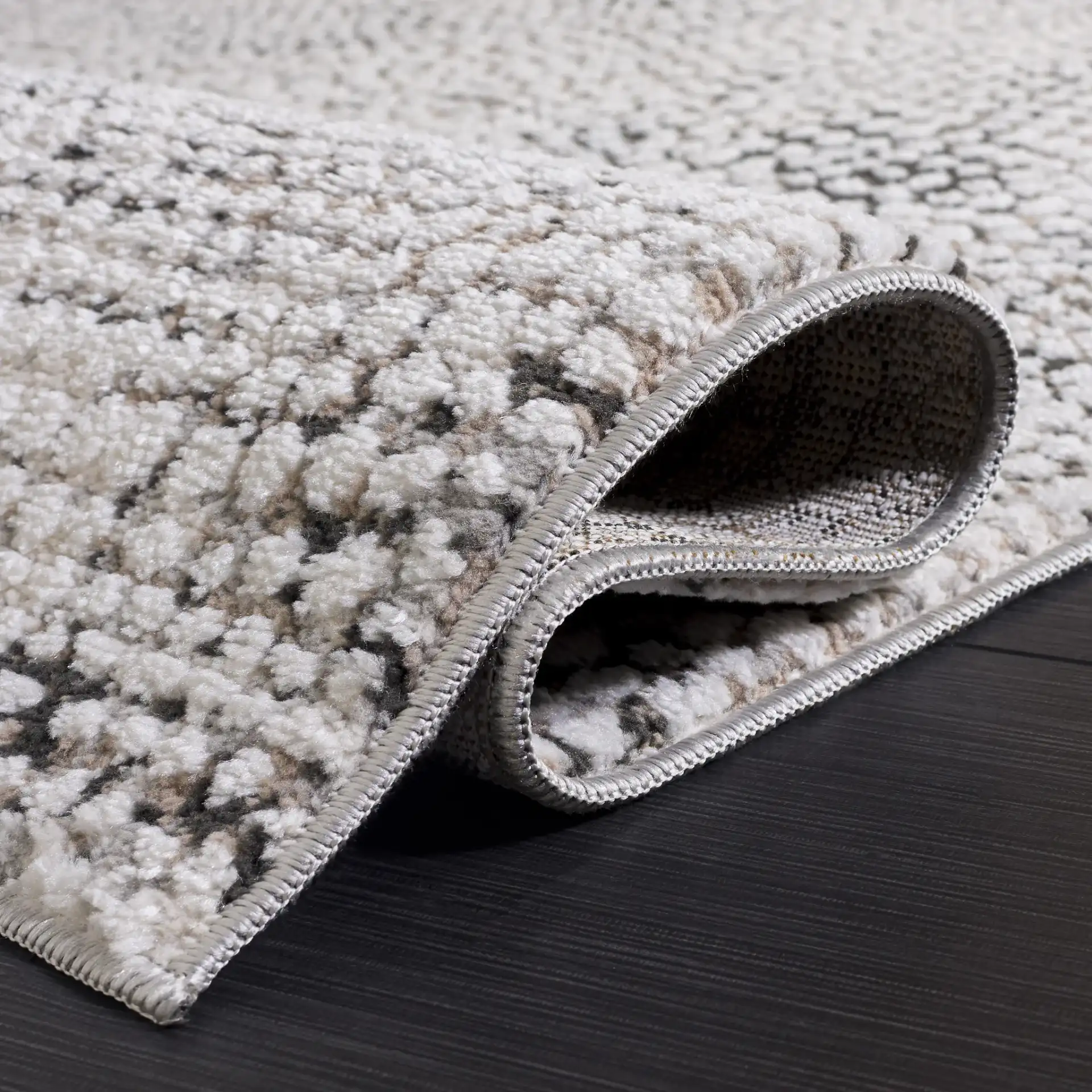 Lunara Pebble Mosaic Rug in Charcoal / Ivory in a styled room