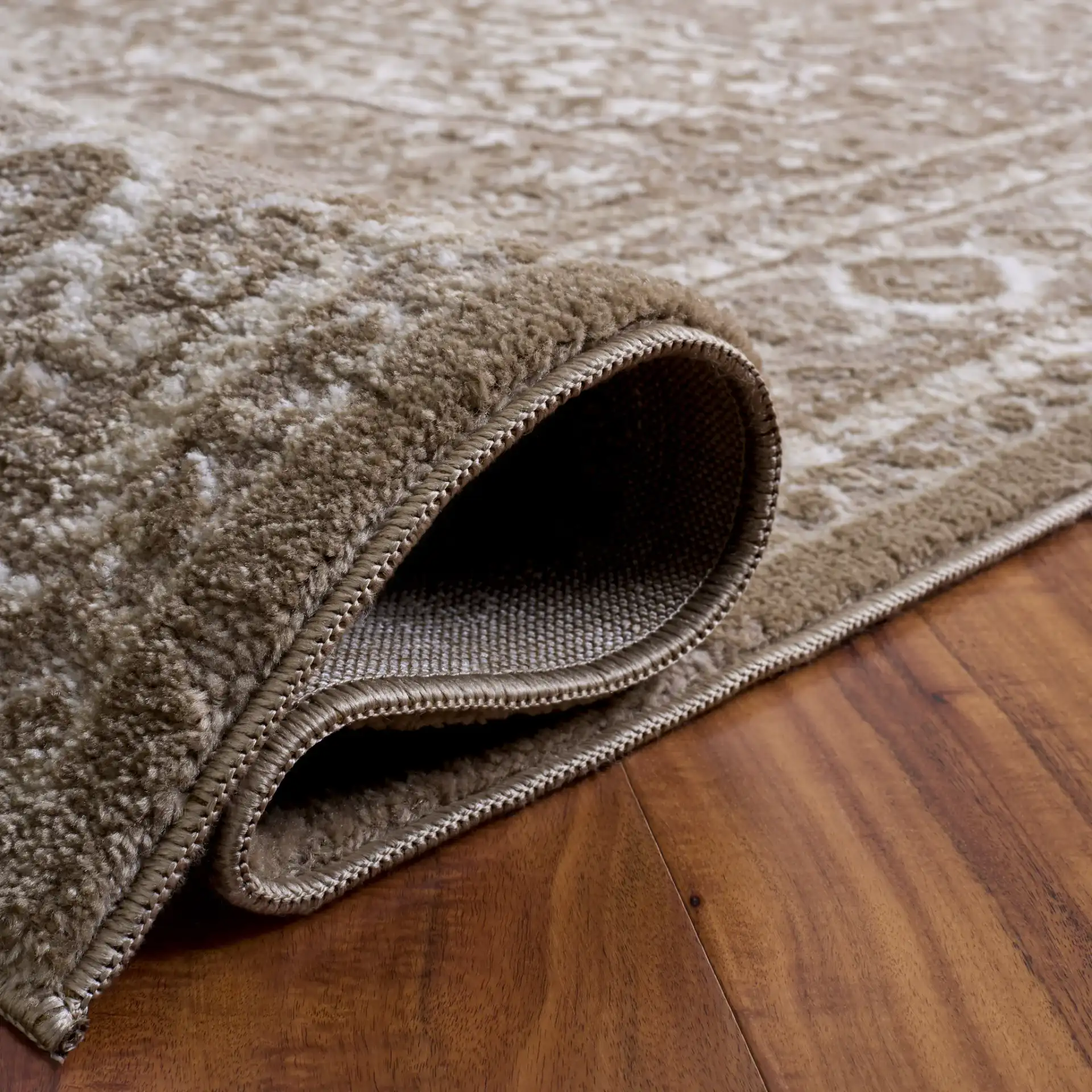 Lunara Distressed Medallion Rug in Beige / Gray in a styled room