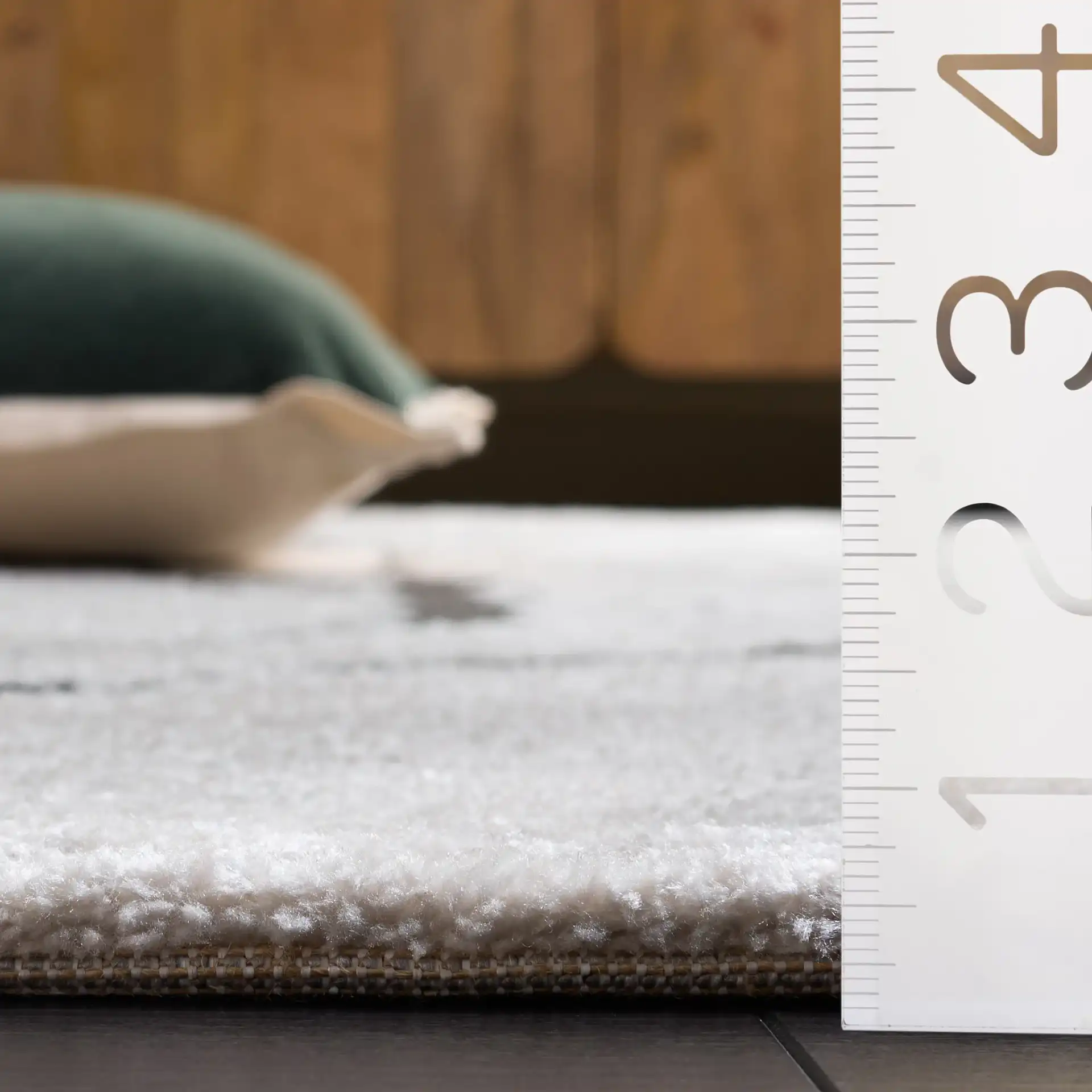 Lunara Modern Marble Rug in Ivory / Charcoal in a styled room