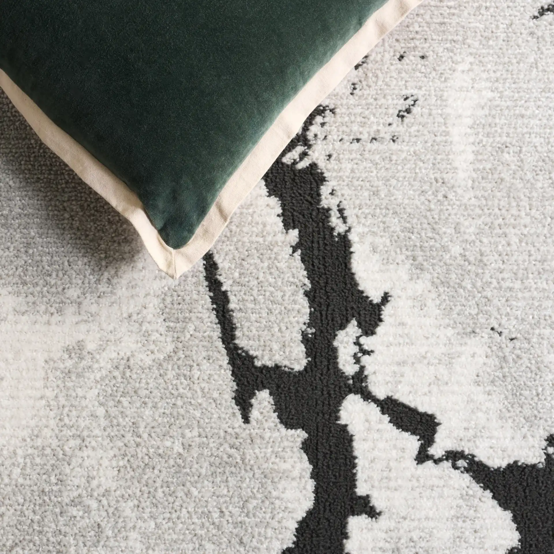 Lunara Modern Marble Rug in Ivory / Charcoal in a styled room