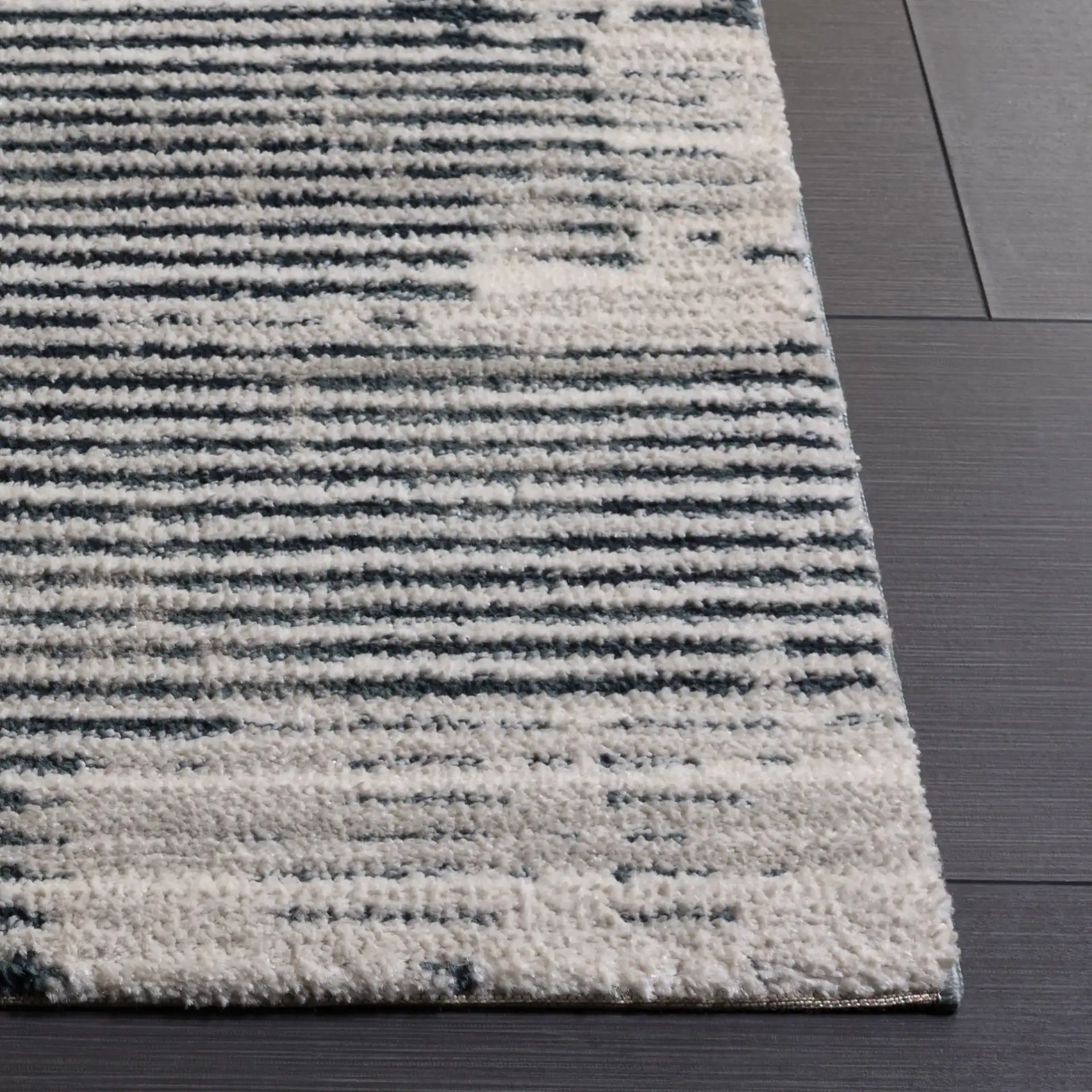 Lunara Modern Striated Rug in Ivory / Blue in a styled room
