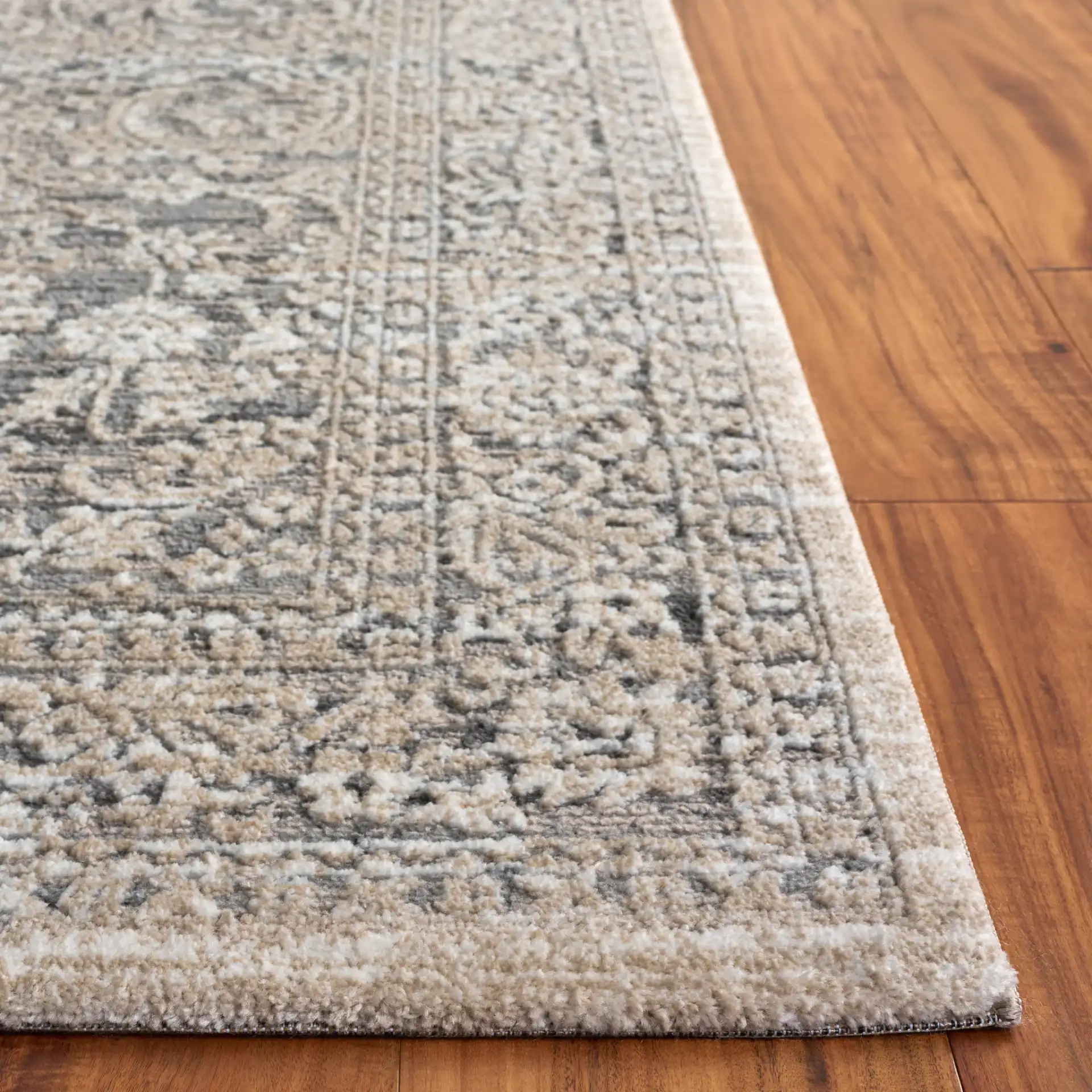 Lunara Transitional Damask Rug in Gray / Beige in a styled room