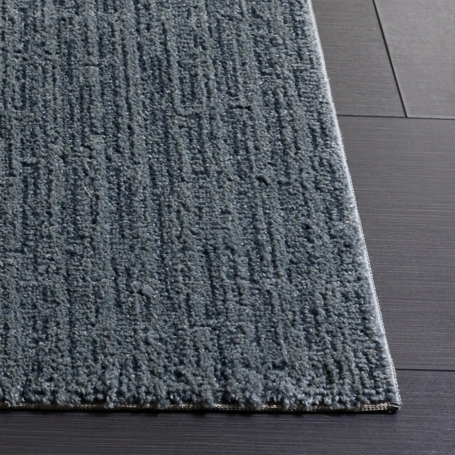 Lunara Modern Striated Rug in Blue / Dark Blue in a styled room