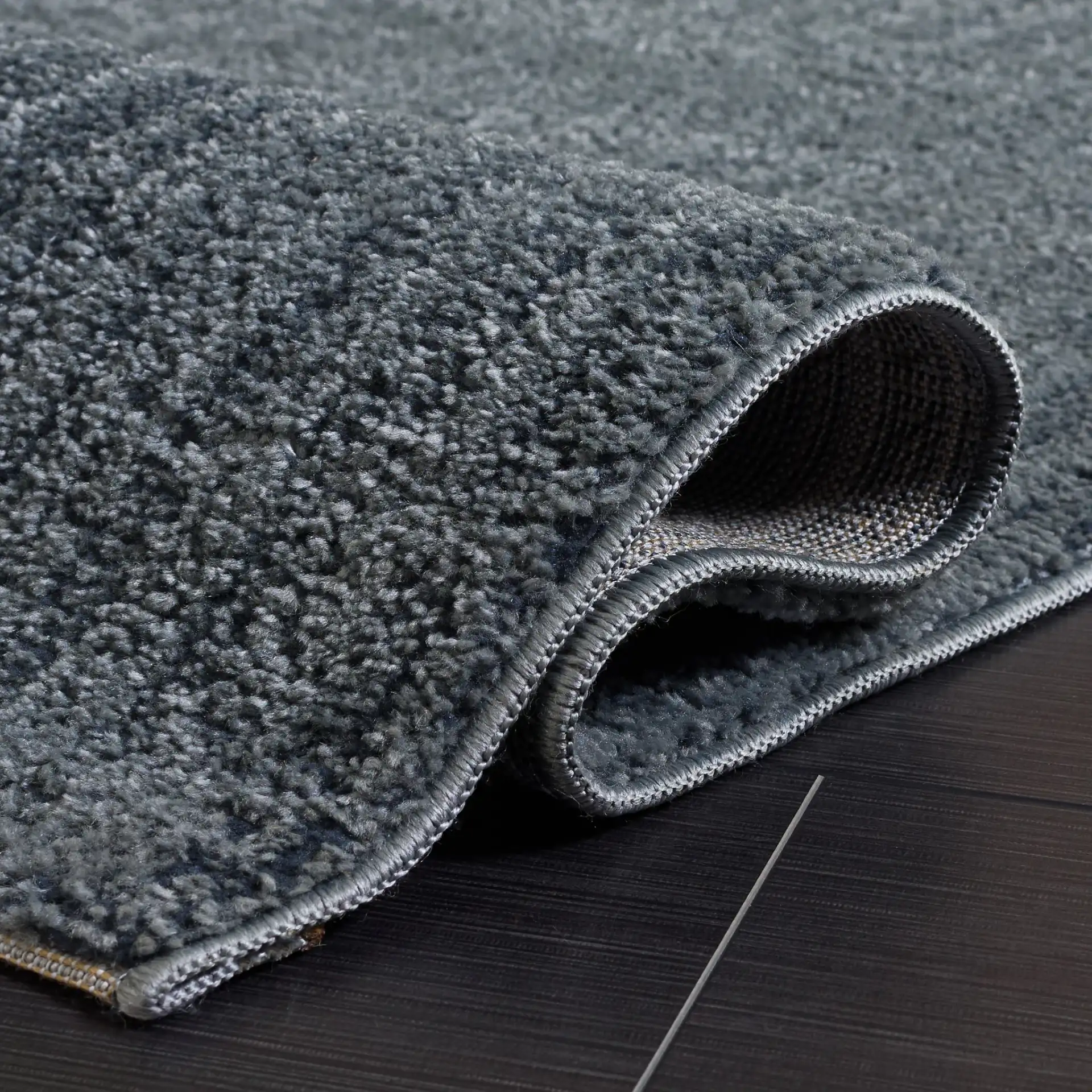 Lunara Modern Striated Rug in Blue / Dark Blue in a styled room