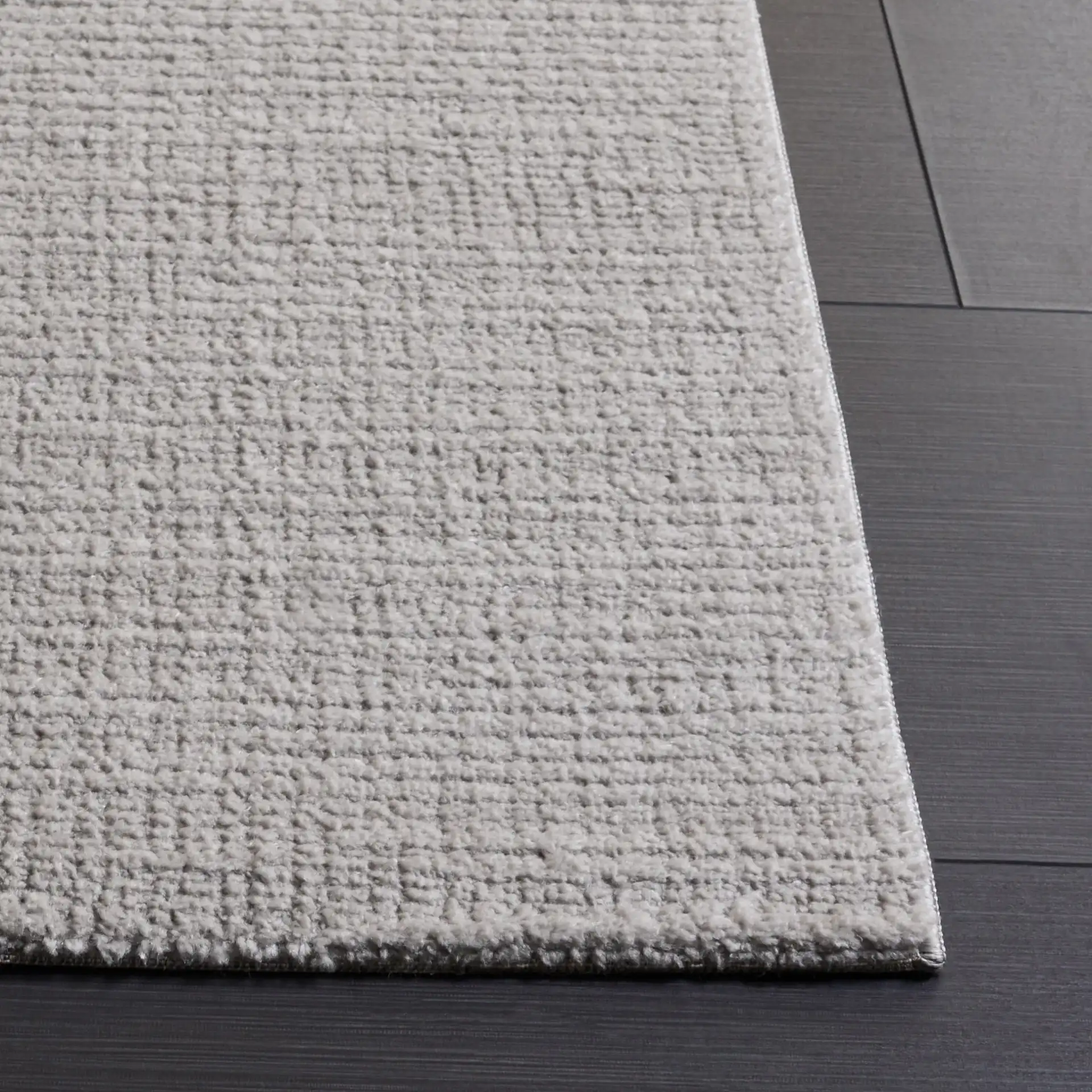 Lunara Modern Ribbed Rug in Gray / Light Gray in a styled room