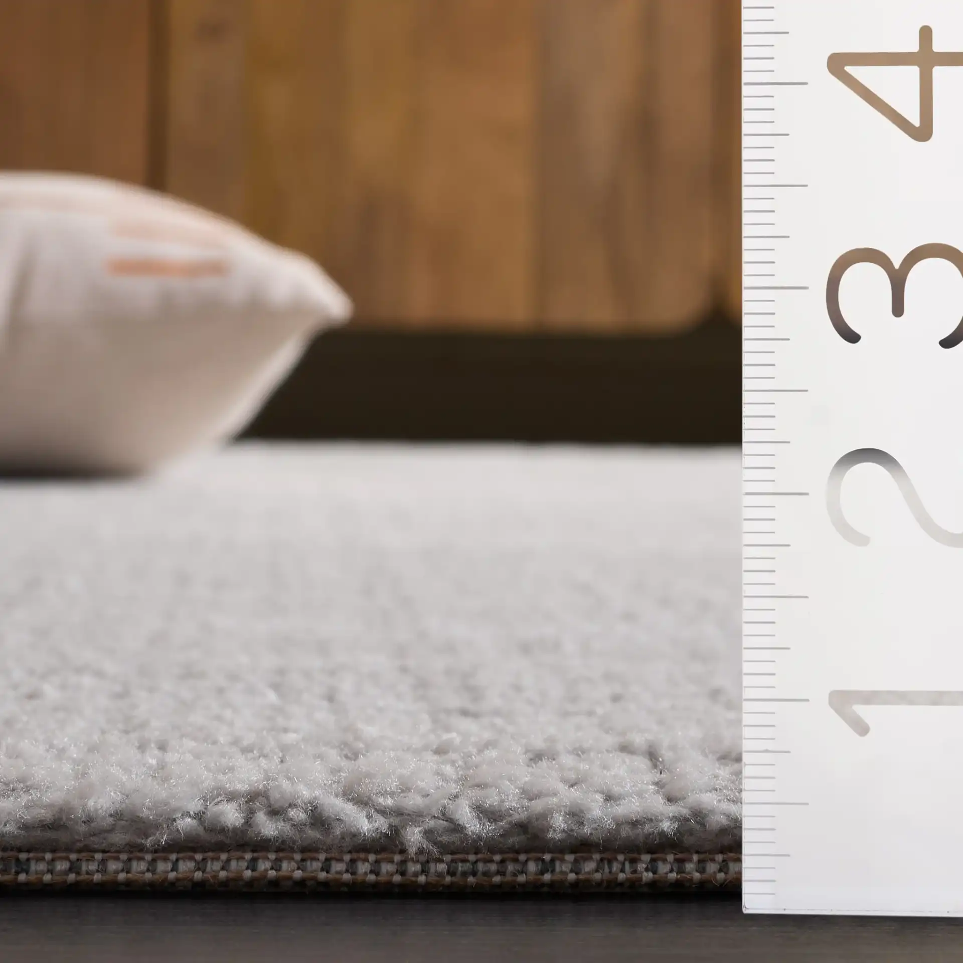 Lunara Modern Ribbed Rug in Gray / Light Gray in a styled room
