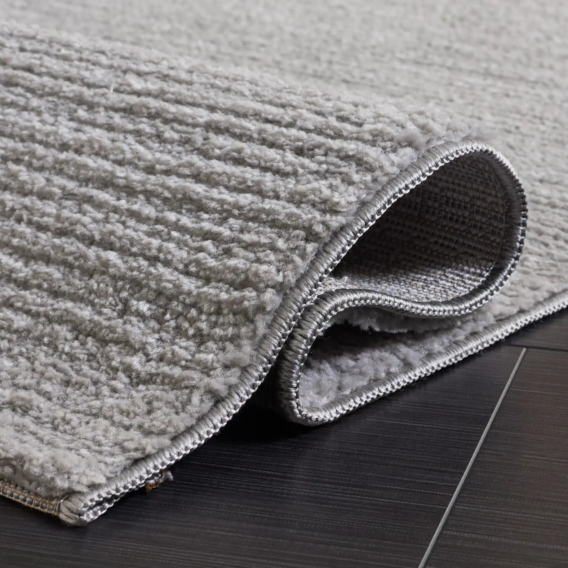 Lunara Modern Ribbed Rug in Gray / Light Gray in a styled room